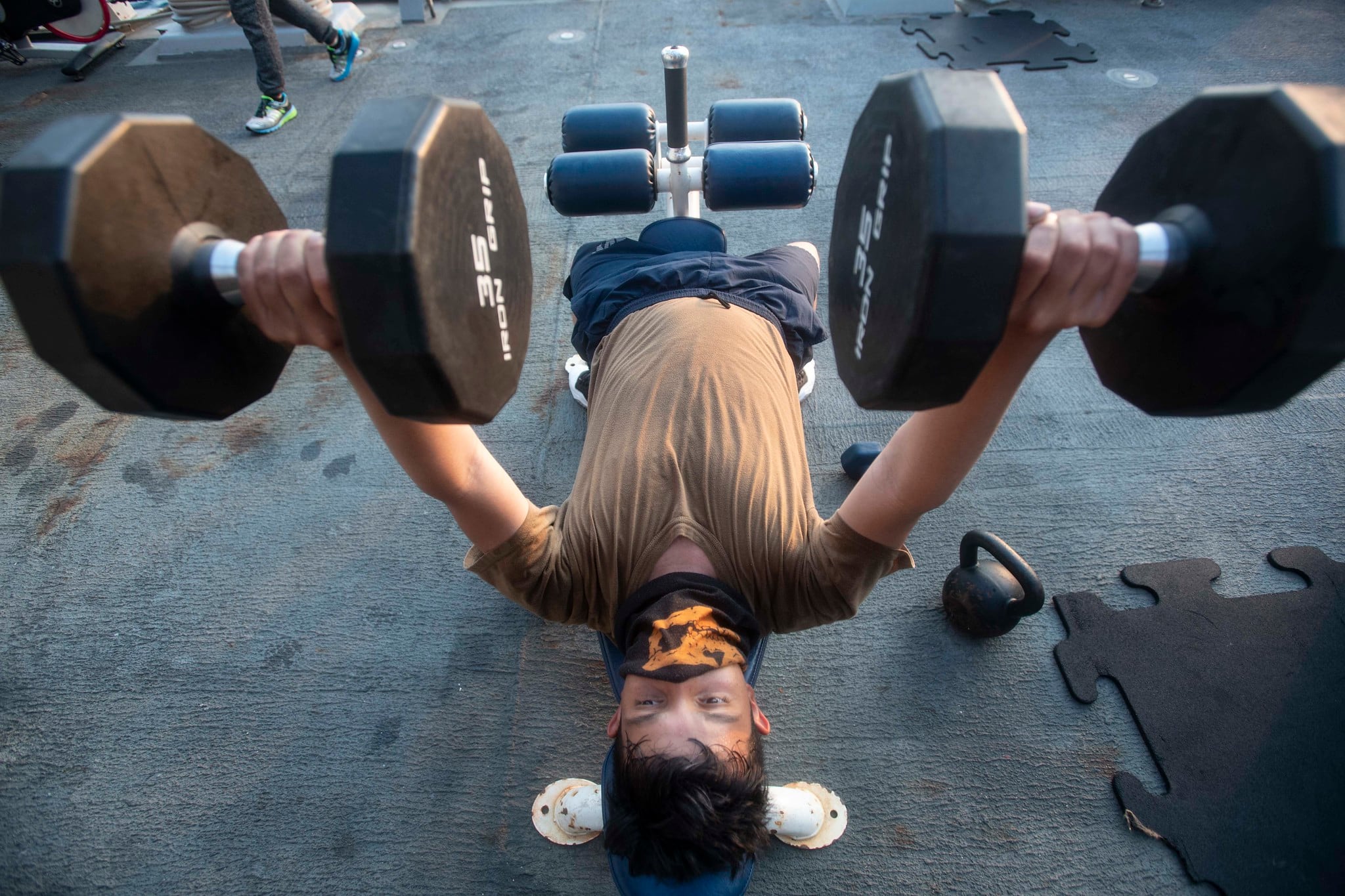 Boatswain's Mate Seaman Apprentice Esau Arellano, assigned to the Arleigh Burke-class guided-missile destroyer USS Ralph Johnson (DDG 114), engages in physical fitness while underway on Aug. 4, 2020, in the Arabian Gulf.