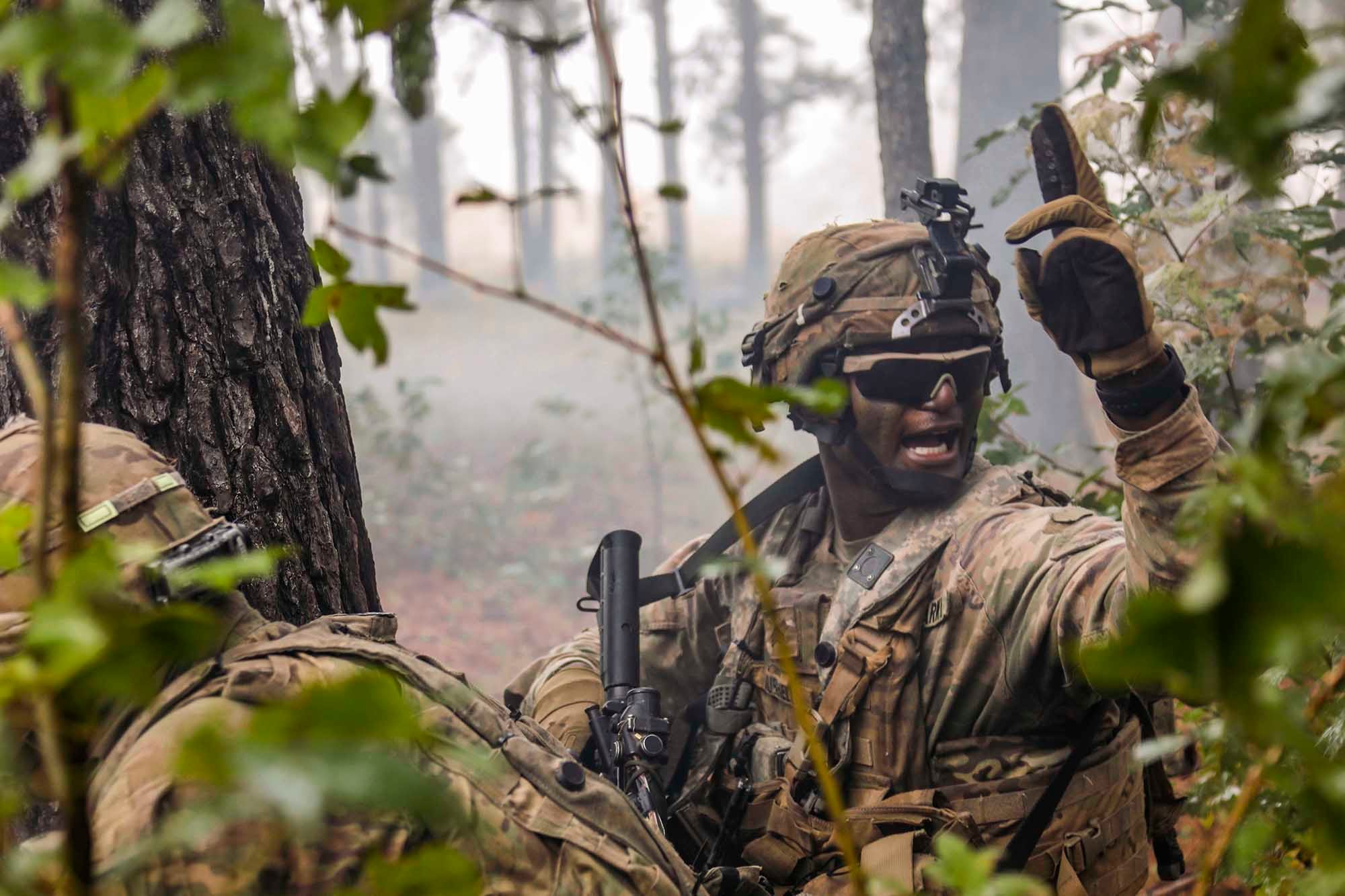 A combat engineer motions his team toward the breach point during the final live-fire exercise of rotation 21-01 on Oct. 27, 2020, at the Joint Readiness Training Center at Fort Polk, La.