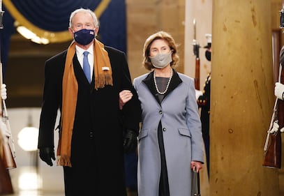 Former President George W. Bush and Laura Bush arrive before President-elect Joe Biden is sworn in as the 46th president on Jan. 20, 2021, at the Capitol in Washington.