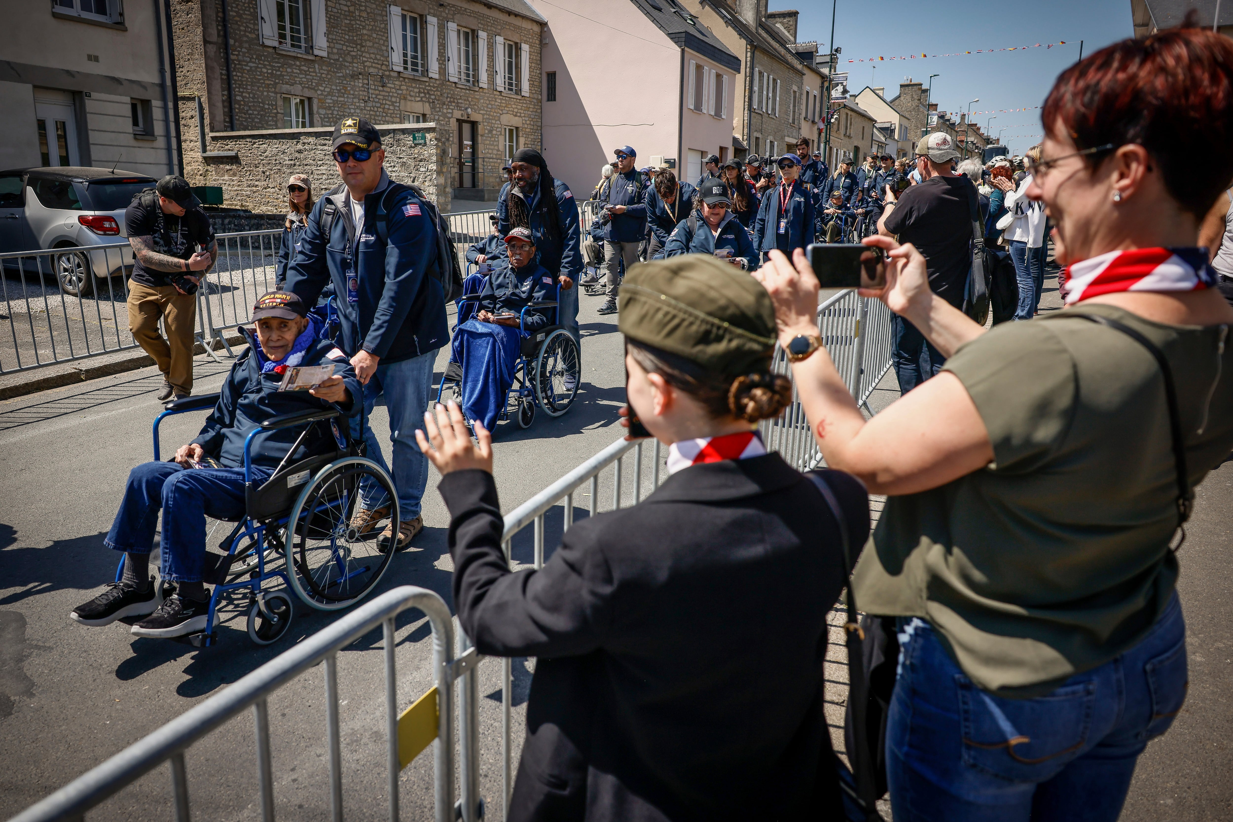 U.S. veterans parade during a gathering in preparation of the 79th D-Day anniversary in Sainte-Mere-Eglise, Normandy, France, Sunday, June 4, 2023.