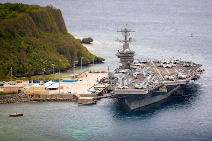 The aircraft carrier USS Theodore Roosevelt (CVN 71) is moored pier side at Naval Base Guam May 15, 2020.