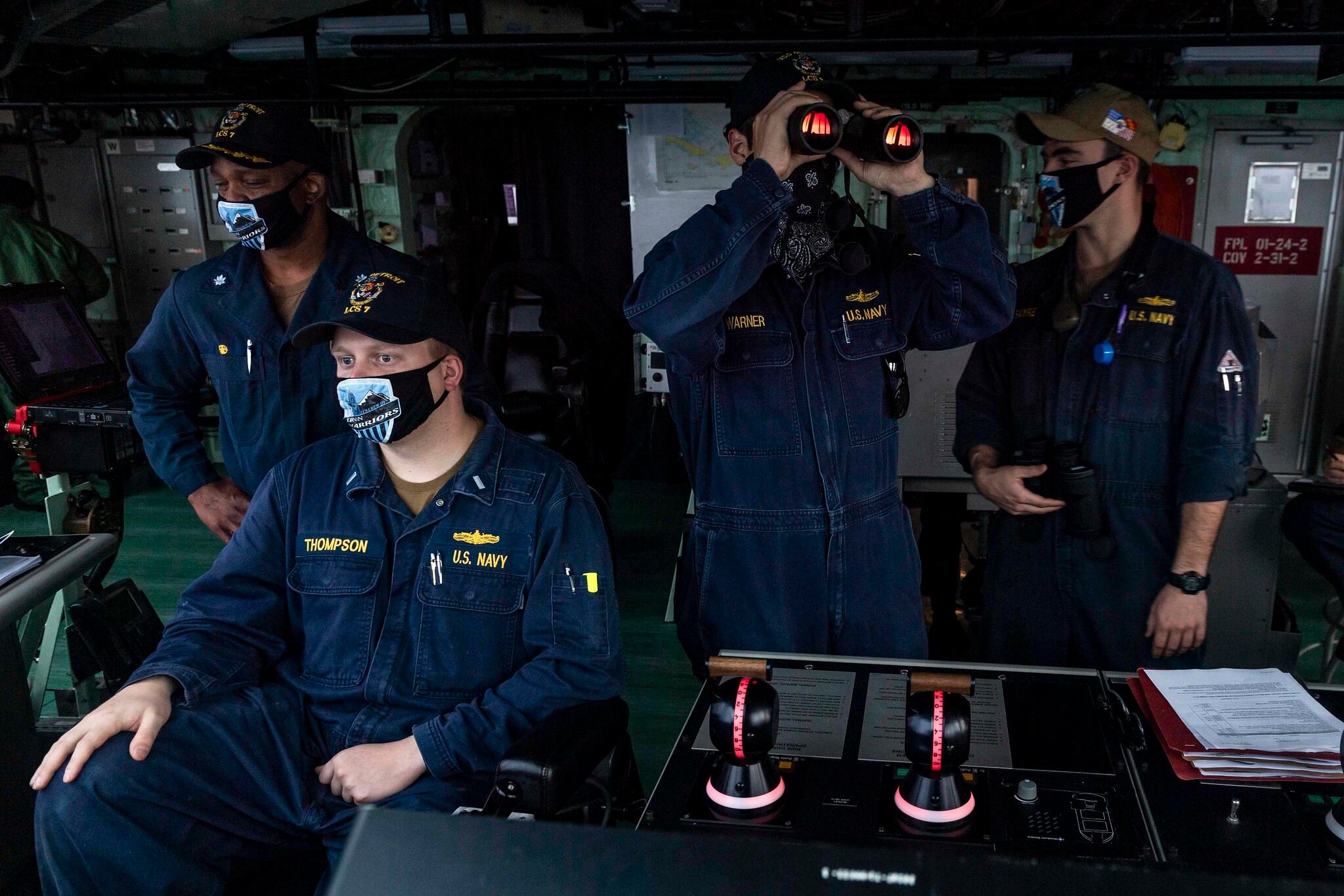 Sailors stand watch on the navigation bridge aboard the Freedom-variant littoral combat ship USS Detroit (LCS 7) as the ship pulls into Colon, Panama, on May 19, 2020, for stores and fuel.