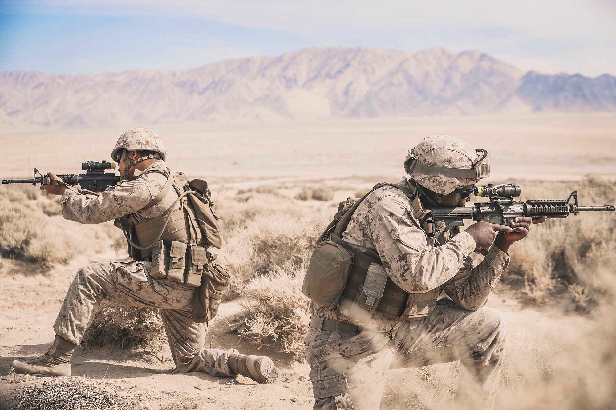 Cpl. Sathya Breckinridge and Lance Cpl. Keavious Blackmon provide cover during Integrated Training Exercise 1-21 at Marine Air Ground Combat Center Twentynine Palms, Calif., Oct. 5, 2020.