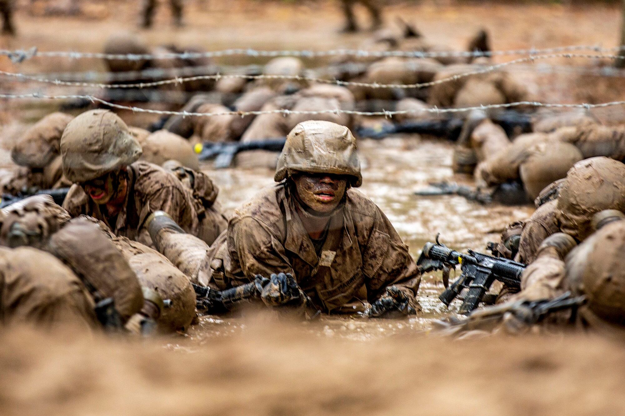 Recruits with November Company, 4th Recruit Training Battalion, work together to move as a fire team through events during the Crucible on Marine Corps Recruit Depot Parris Island, S.C., Dec 3, 2020.