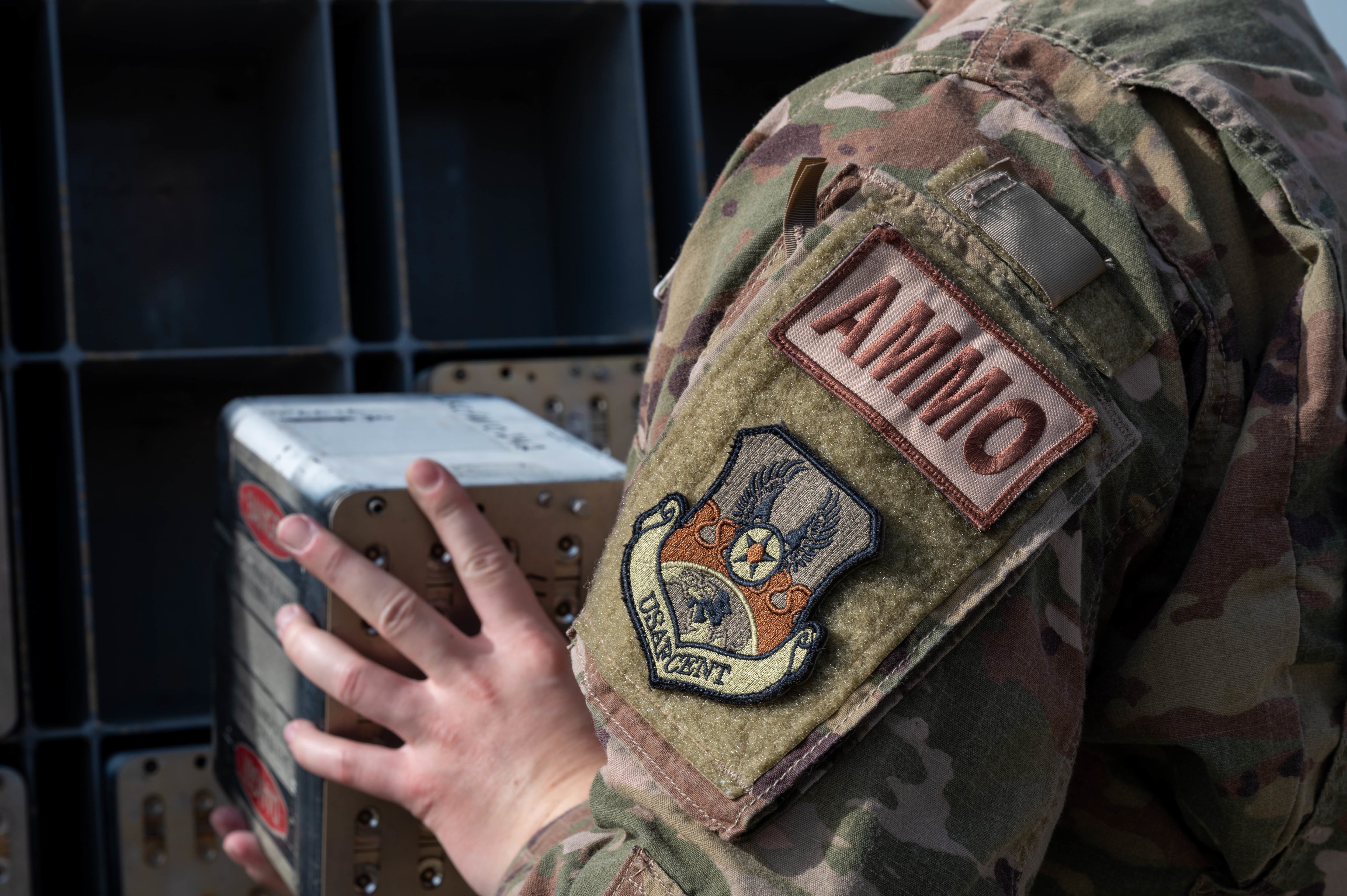 An airman loads chaff and flare countermeasure mods on a trailer at Ali Al Salem Air Force Base, Kuwait, Jan. 26, 2022.