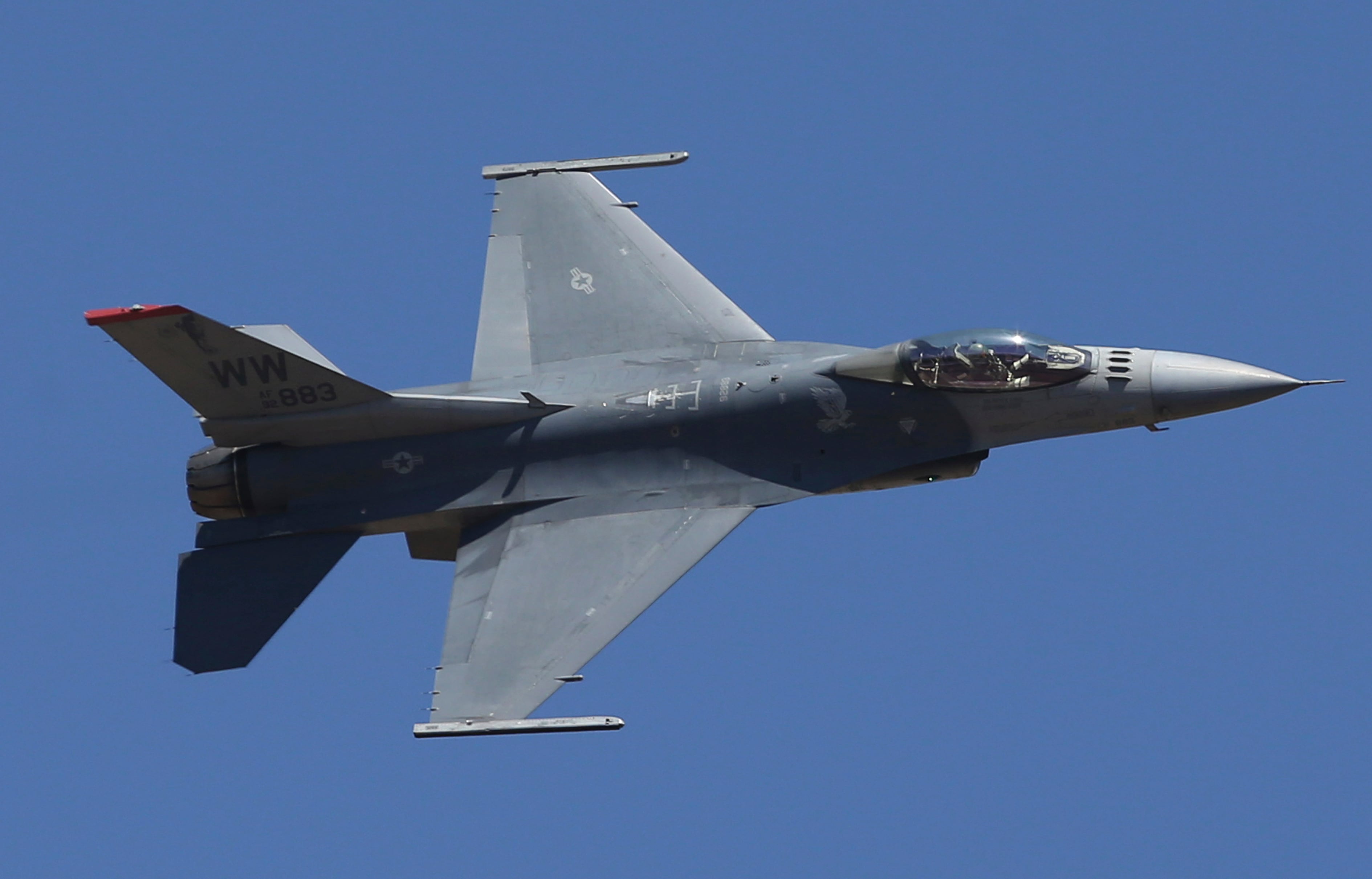 U.S. fighter aircraft F-16 performs aerobatic maneuvers on the last day of Aero India 2019 at Yelahanka air base in Bangalore, India, Feb. 24, 2019.