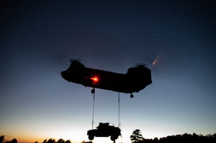 U.S. Army paratroopers perform night sling operations with a CH-47 Chinook in preparation for Exercise Saber Junction 20 on Aug. 5, 2020, as part of the 173rd Brigade Field Training Exercise in Grafenwoehr Training Area, Germany.