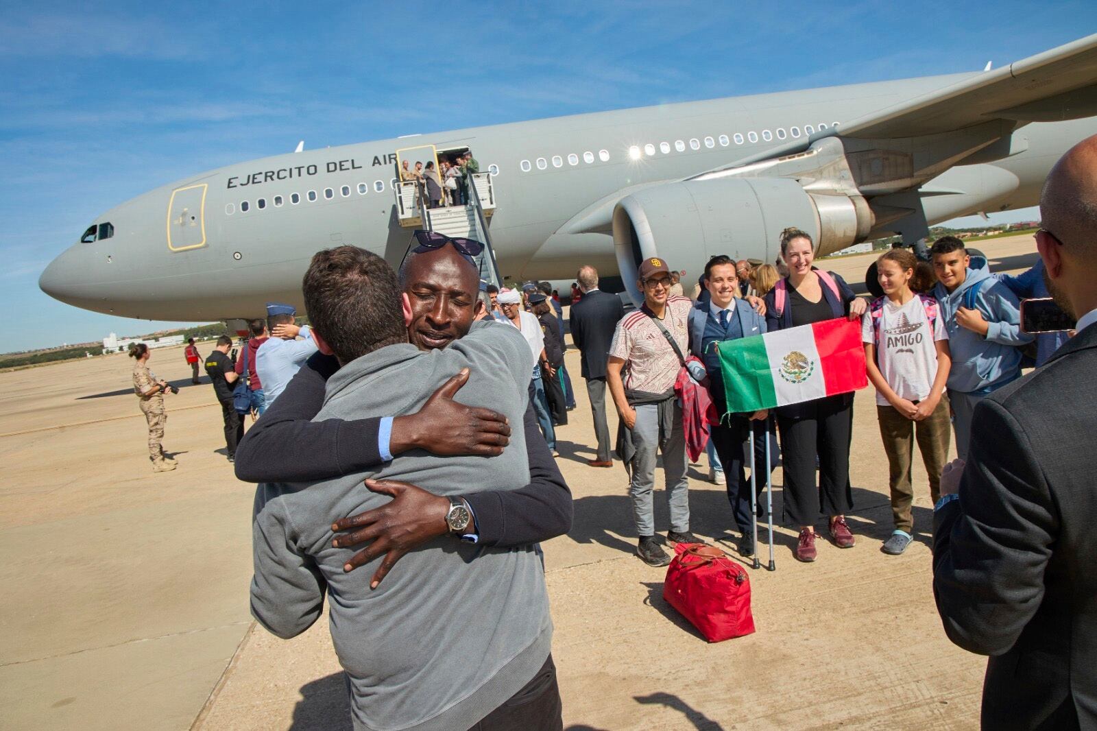 In this photo provided by the Spanish Defence Ministry passengers from Sudan disembark from a Spanish Air Force aircraft at Torrejon Air Base in Madrid, Monday April. 24, 2023.