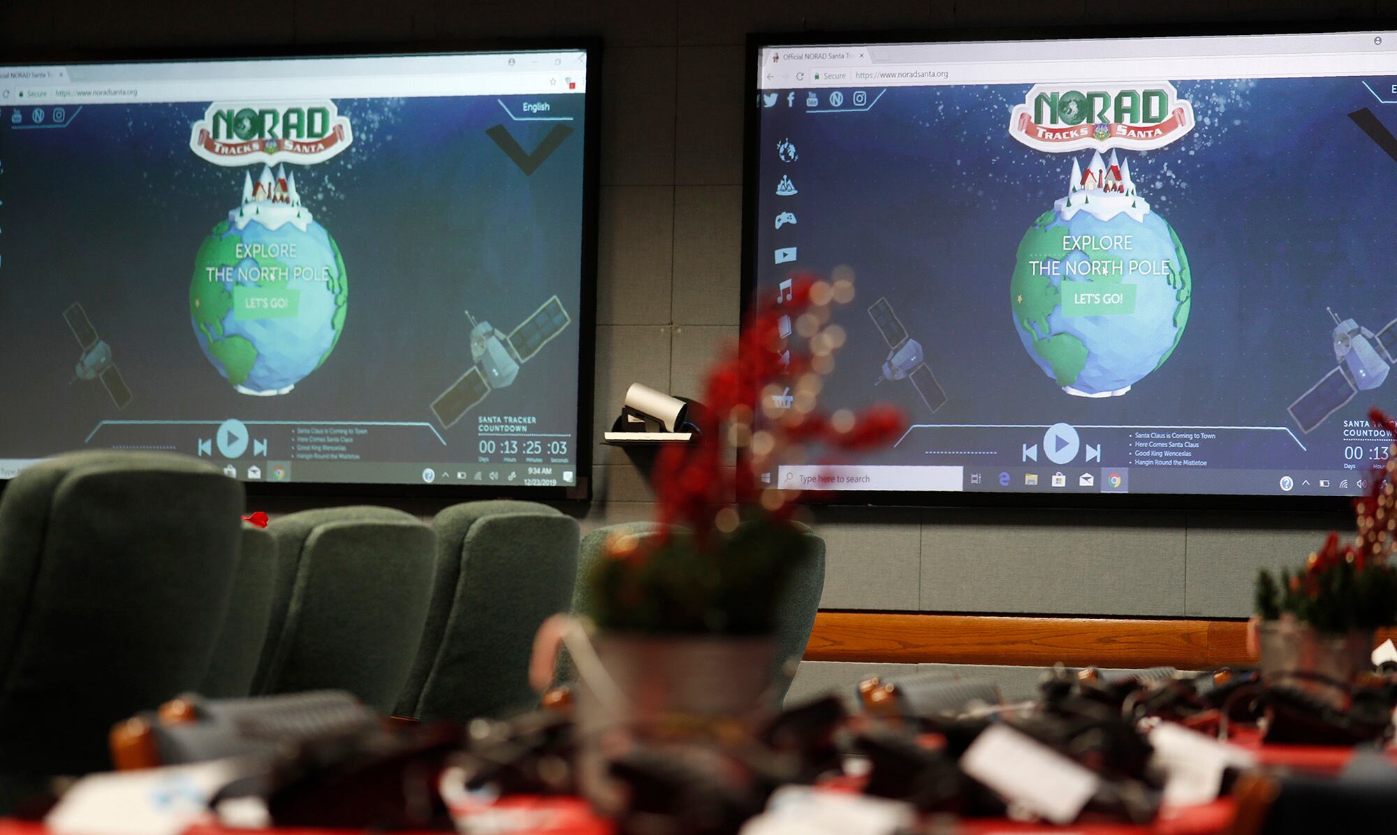 In this Dec. 23, 2019, file photo monitors are illuminated in the NORAD Tracks Santa center at Peterson Air Force Base in Colorado Springs, Colo.