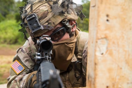 A soldier scans his lane during a rifle qualification range May 1, 2020 at Schofield Barracks, Hawaii.