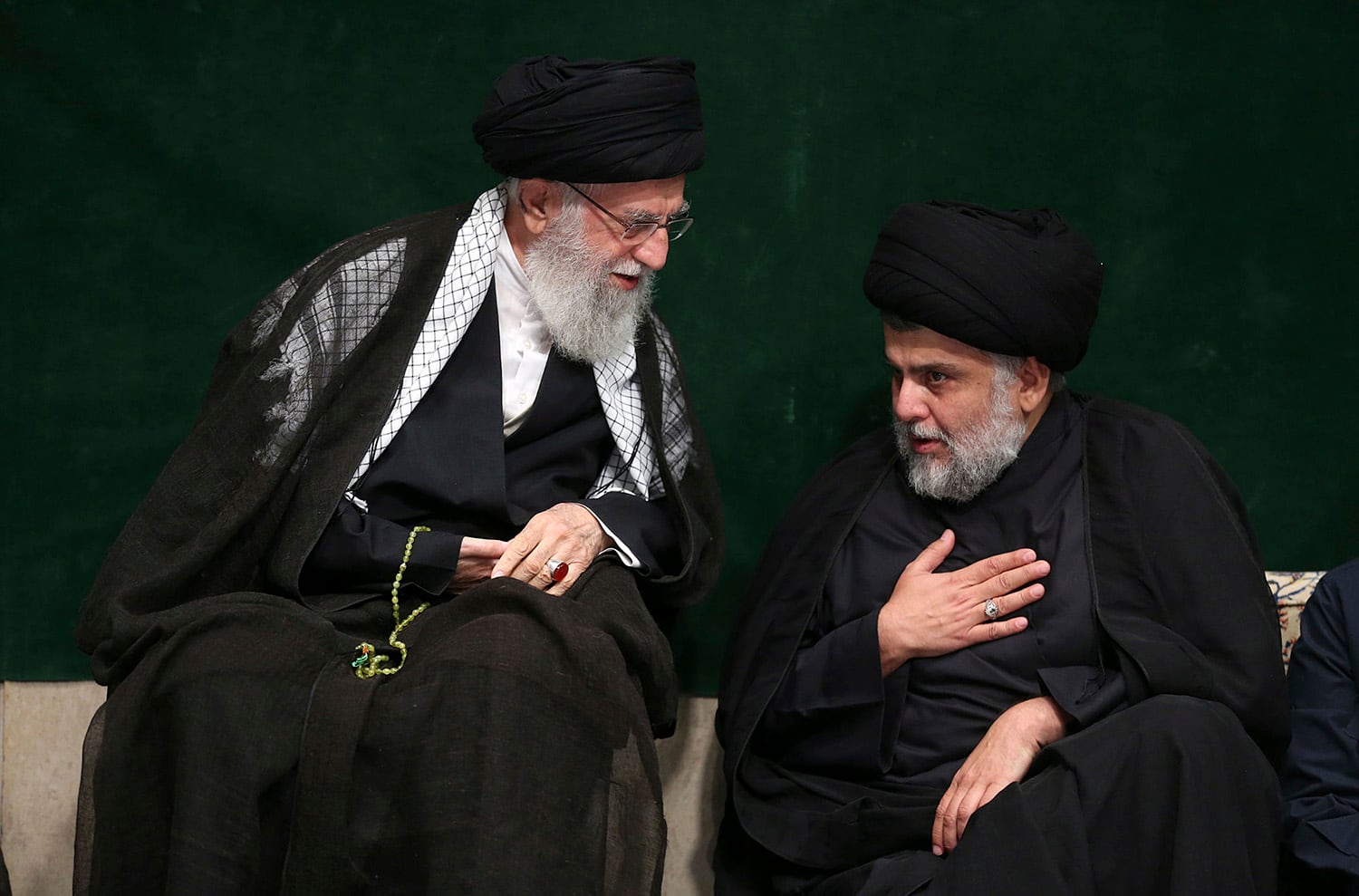 Supreme Leader Ayatollah Ali Khamenei, left, greets Iraqi Shiite cleric Muqtada al-Sadr