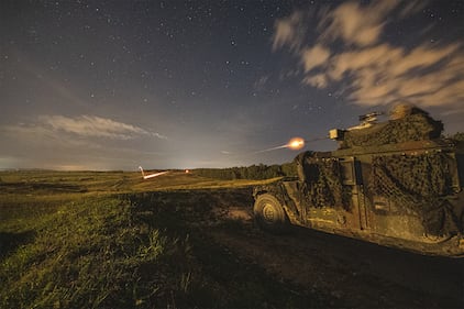 A soldier fires a .50-caliber machine gun during a live-fire exercise at Grafenwoehr Training Area in Germany, Aug. 21, 2019.