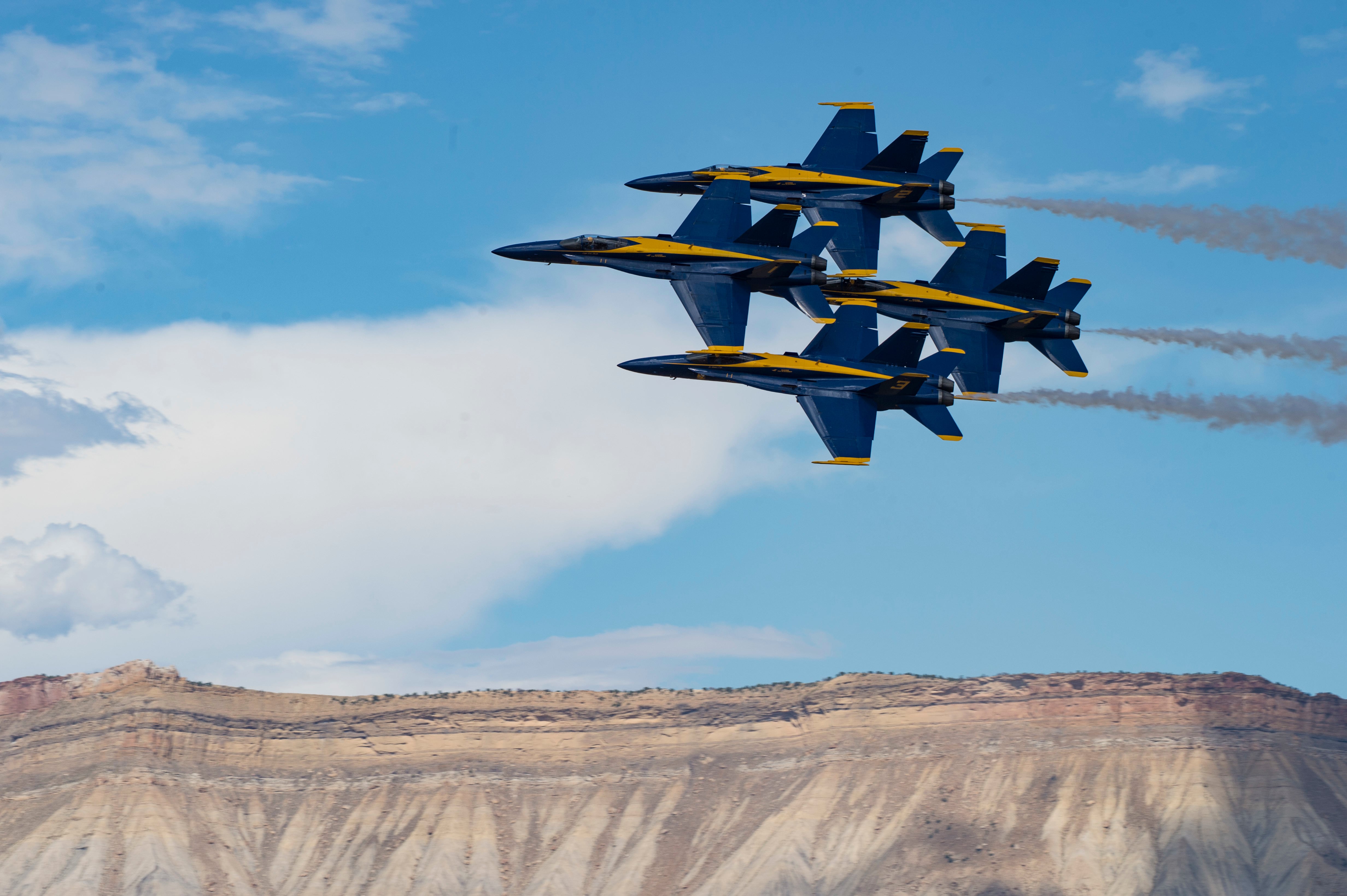 The U.S. Navy Flight Demonstration Squadron, the Blue Angels, diamond pilots perform the “Diamond 360” maneuver July 27, 2019, in a demonstration at the Grand Junction Air Show in Grand Junction, Colo.