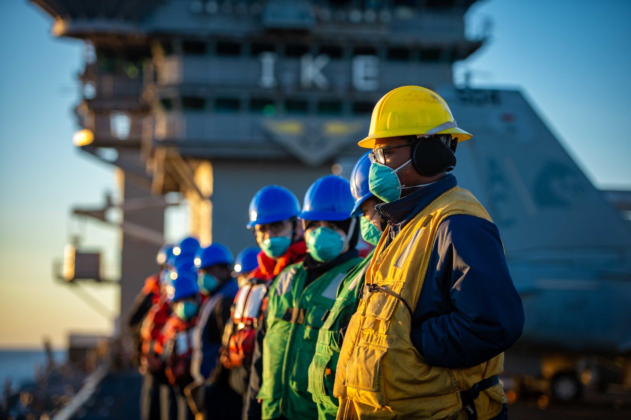 Sailors prepare for a replenishment-at-sea on Feb. 4, 2021, with the fleet-replenishment oiler USNS Kanawha (T-AO 196) onboard the Nimitz-class aircraft carrier USS Dwight D. Eisenhower (CVN 69) in the Atlantic Ocean.