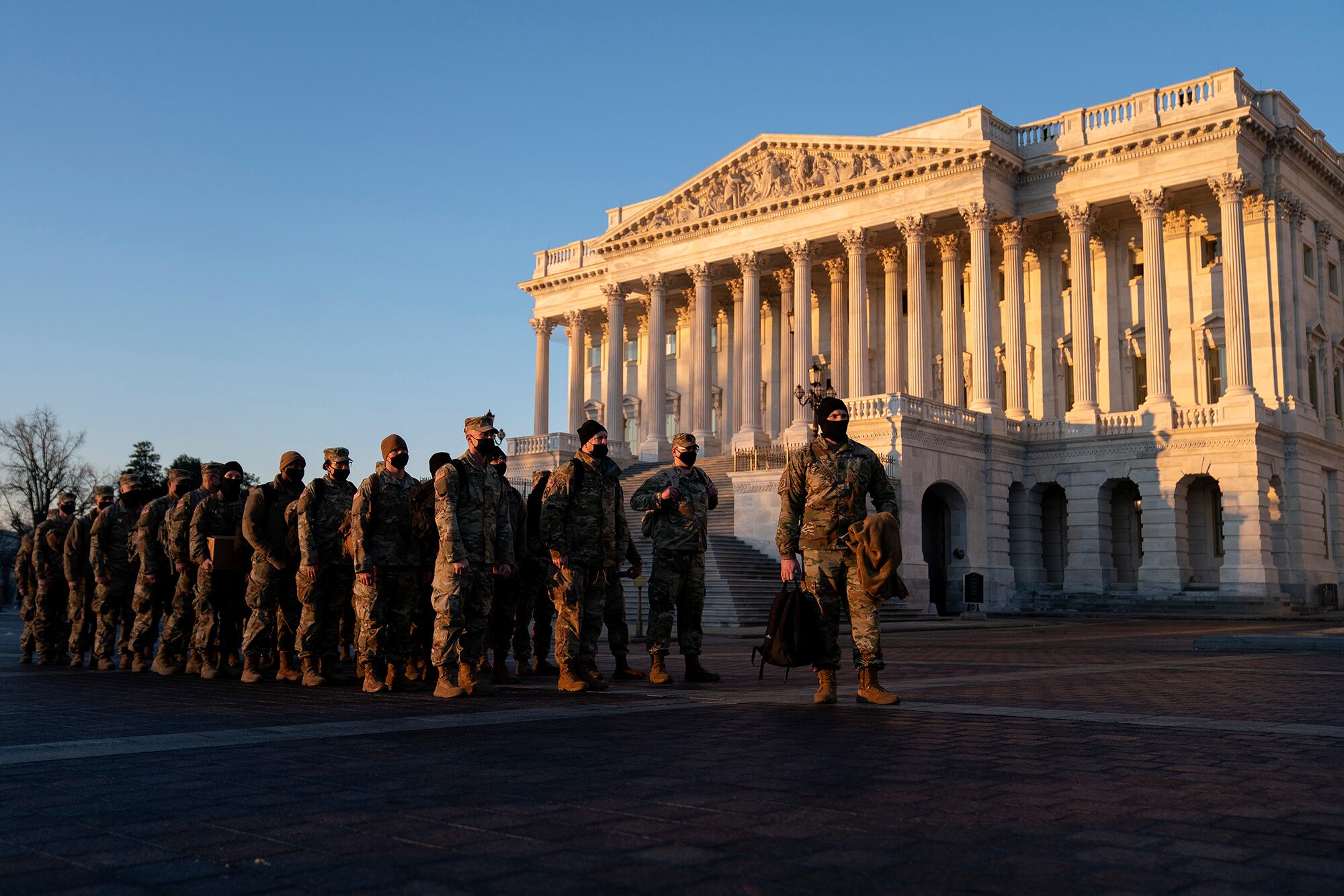 Members of the National Guard gather outside the U.S. Capitol on Jan. 12, 2021, in Washington.