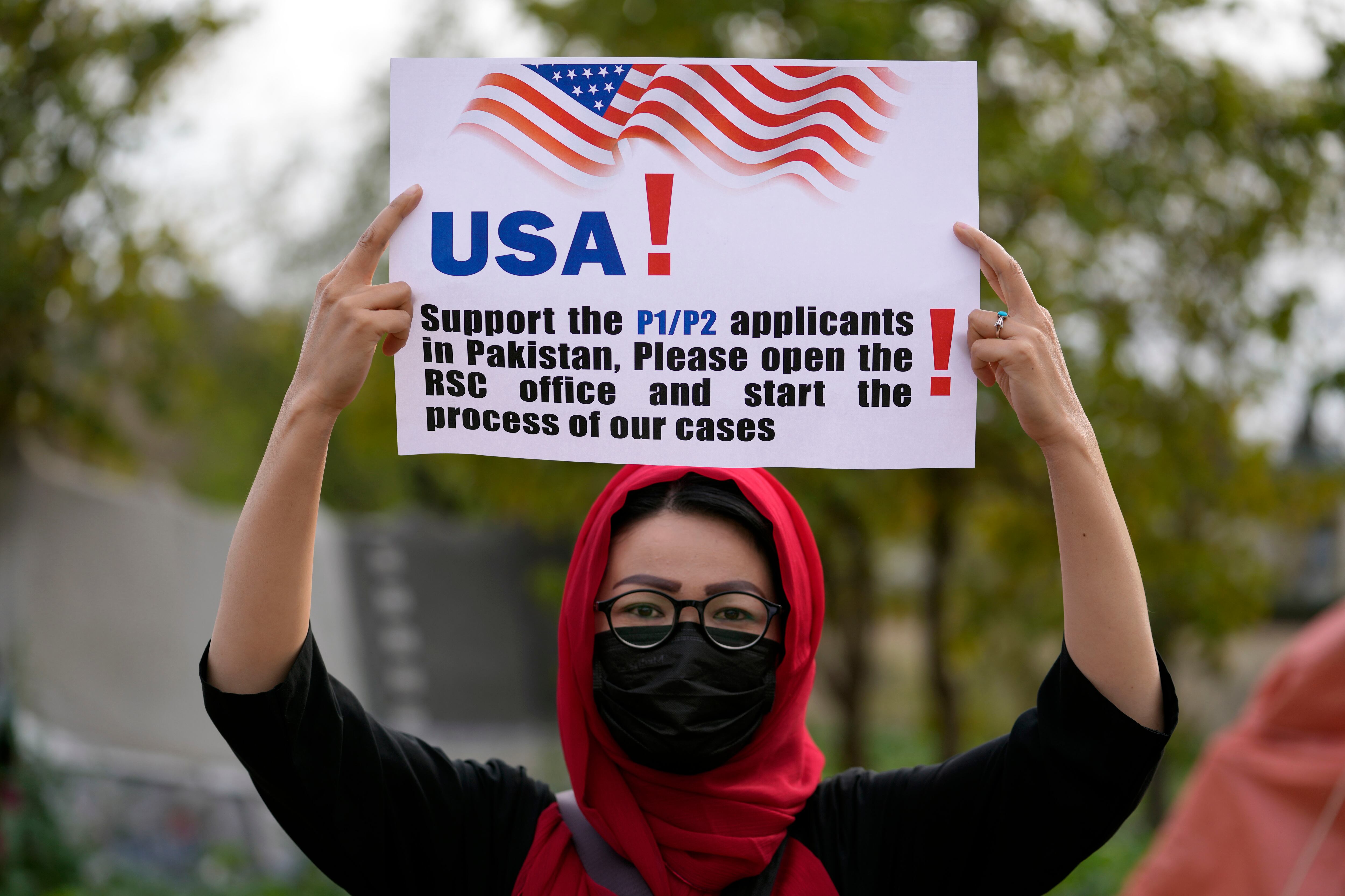 An Afghan refugee attends a rally demanding their U.S. visas to be processed in Islamabad, Pakistan, Sunday, Feb. 26, 2023.