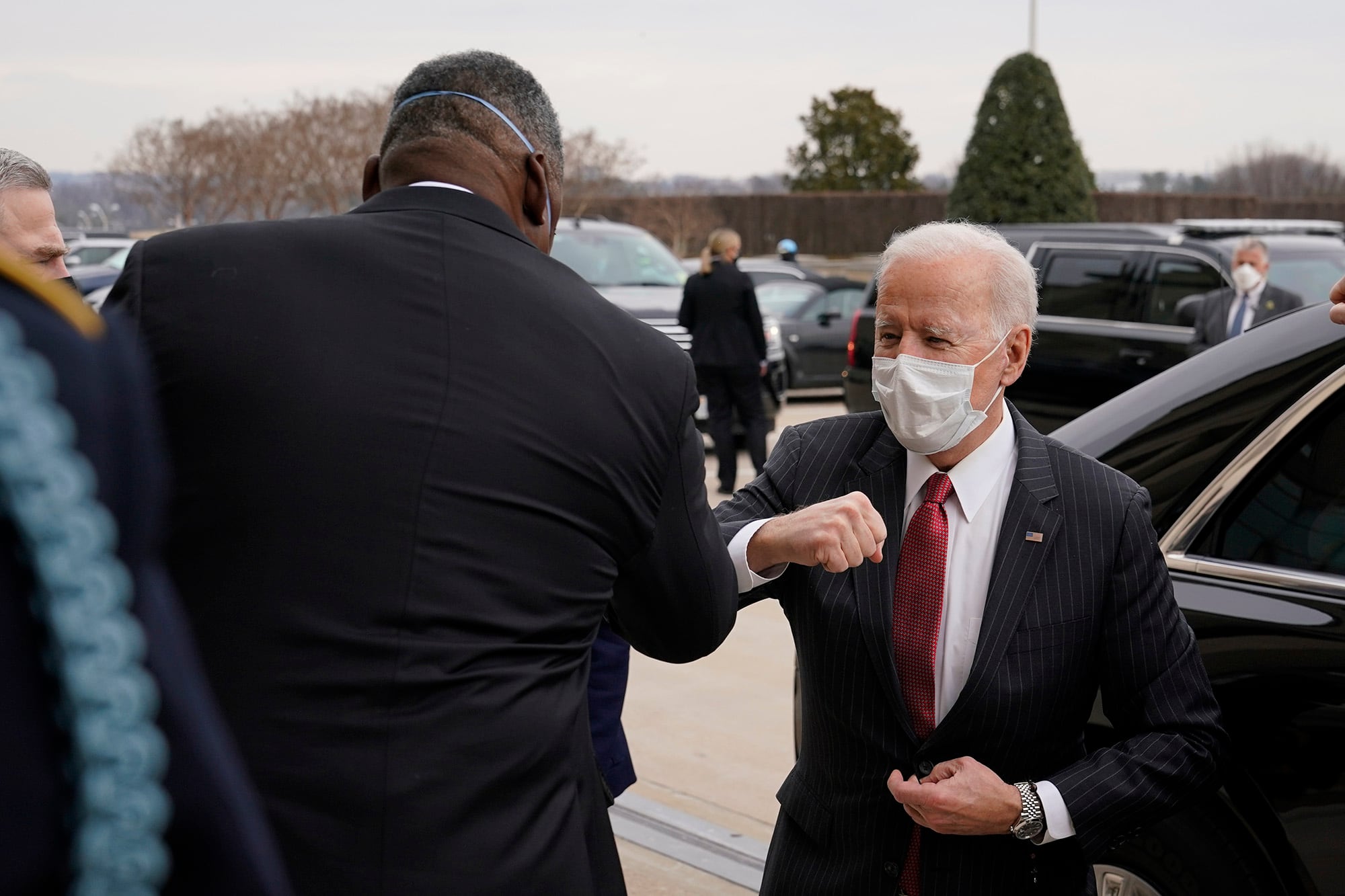 President Joe Biden elbow bumps Defense Secretary Lloyd Austin as he arrives at the Pentagon, Wednesday, Feb. 10, 2021, in Washington.