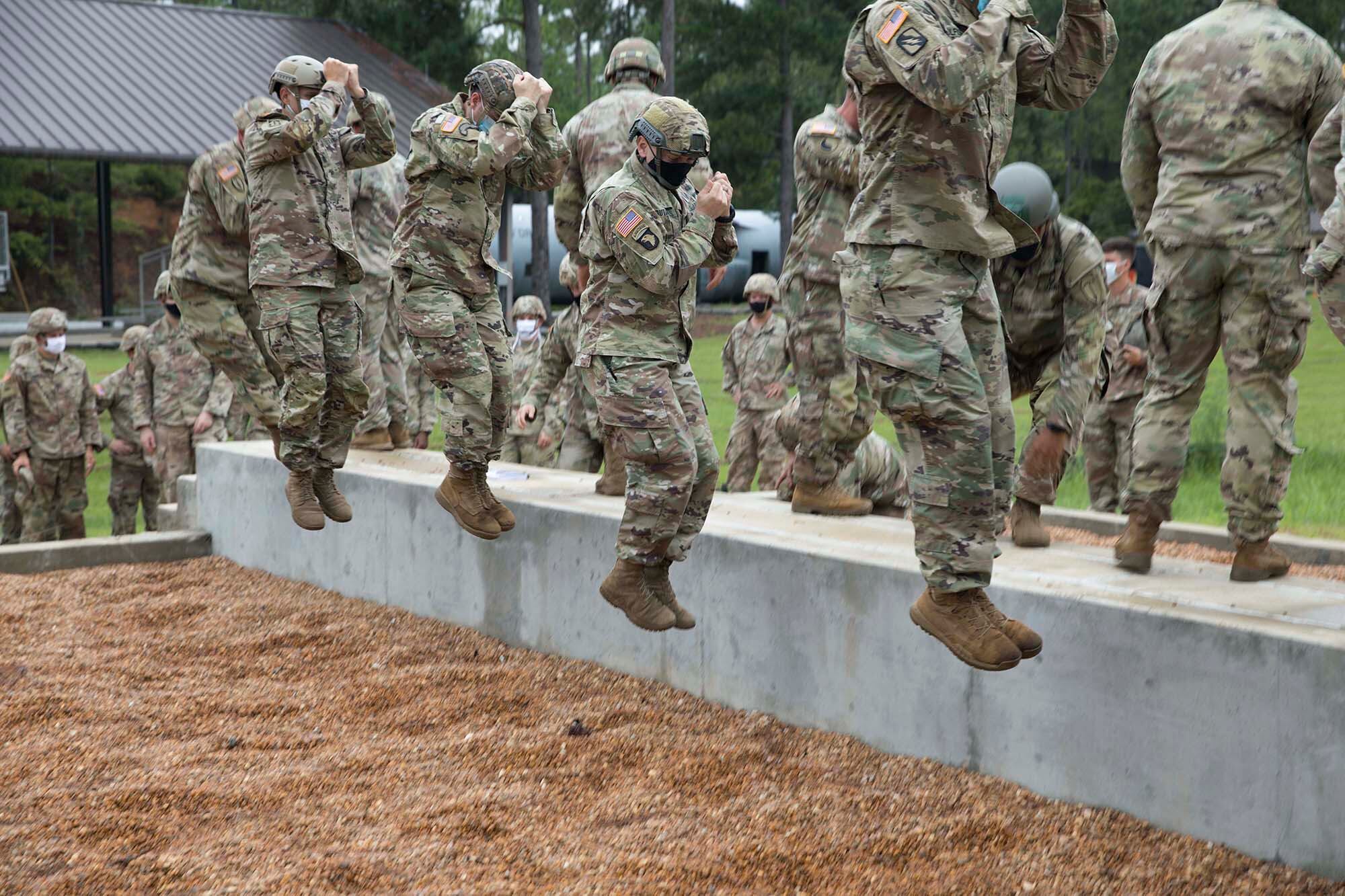 A group of U.S. Army paratroopers conducts a Parachute Landing Fall at the Warrior Training Center, Fort Benning, Ga., Aug. 24, 2020.