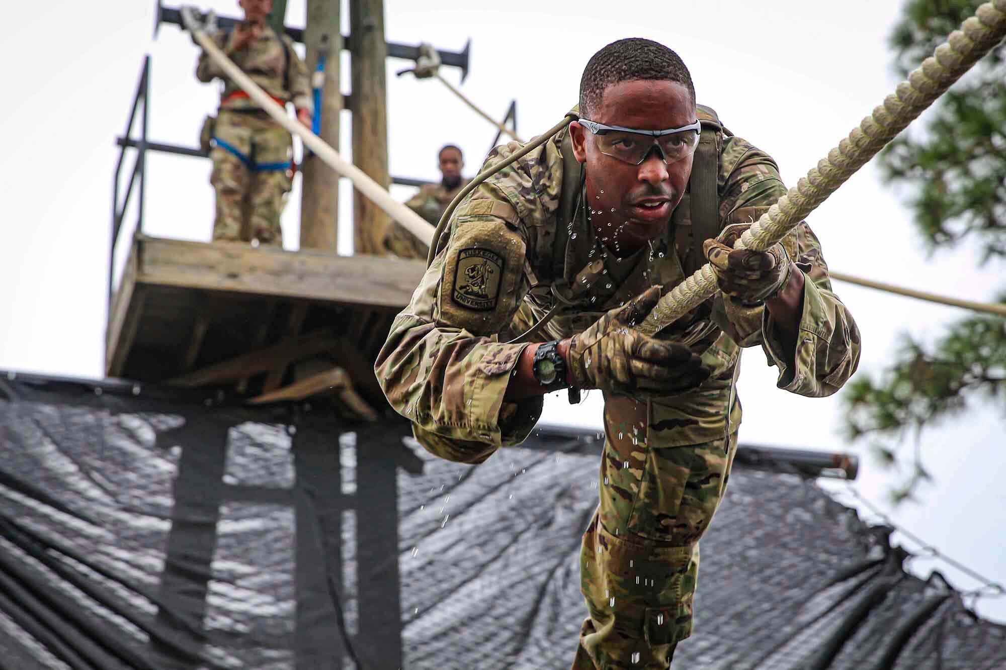 A Tuskegee University Army ROTC cadet slides down the inverted rope descent during an FTX at Fort Benning, Ga., on Sept. 19, 2020.