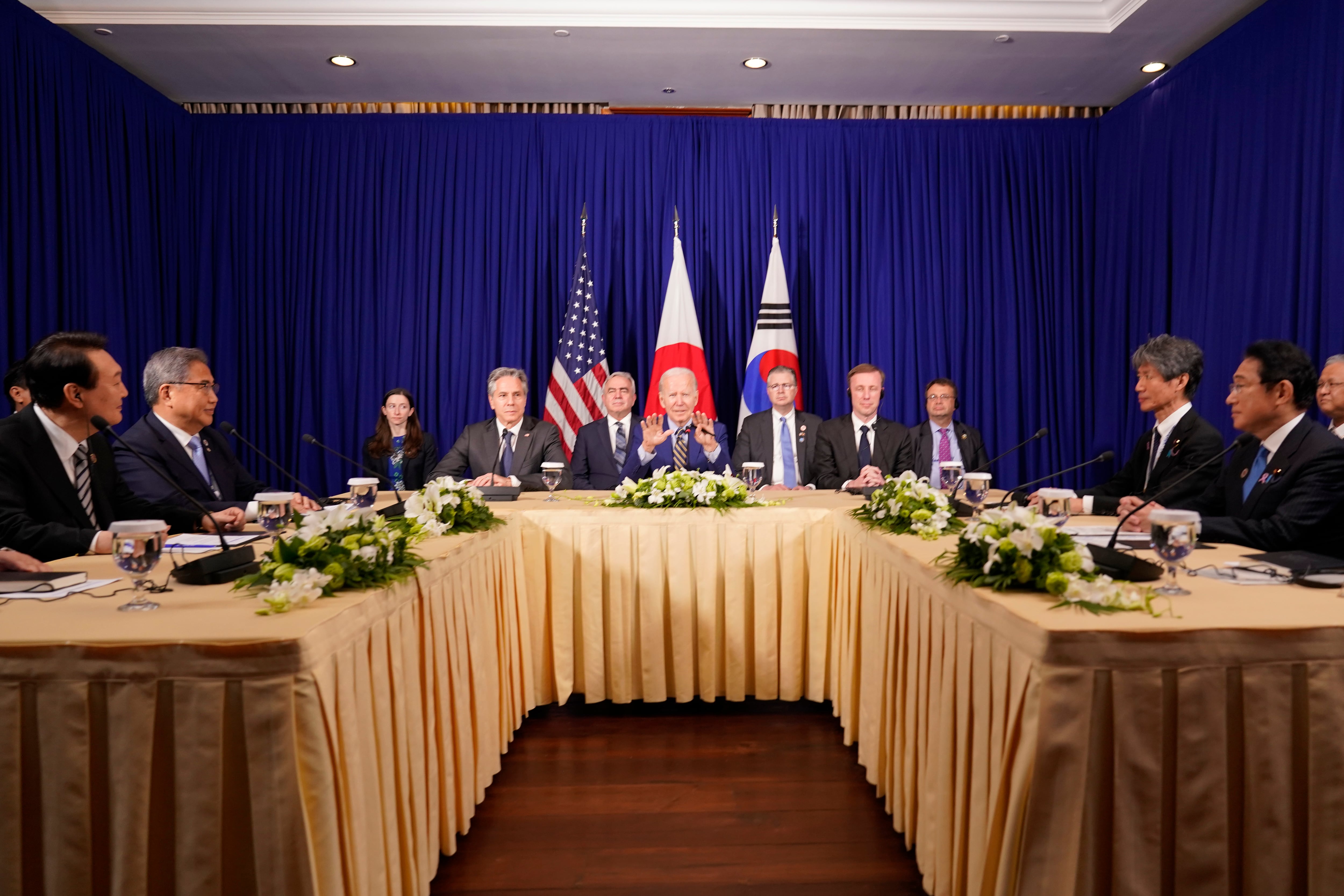 U.S. President Joe Biden, center, meets with South Korean President Yoon Suk Yeol, left, and Japanese Prime Minister Fumio Kishida, right, on the sidelines of the Association of Southeast Asian Nations (ASEAN) summit, Sunday, Nov. 13, 2022, in Phnom Penh, Cambodia.