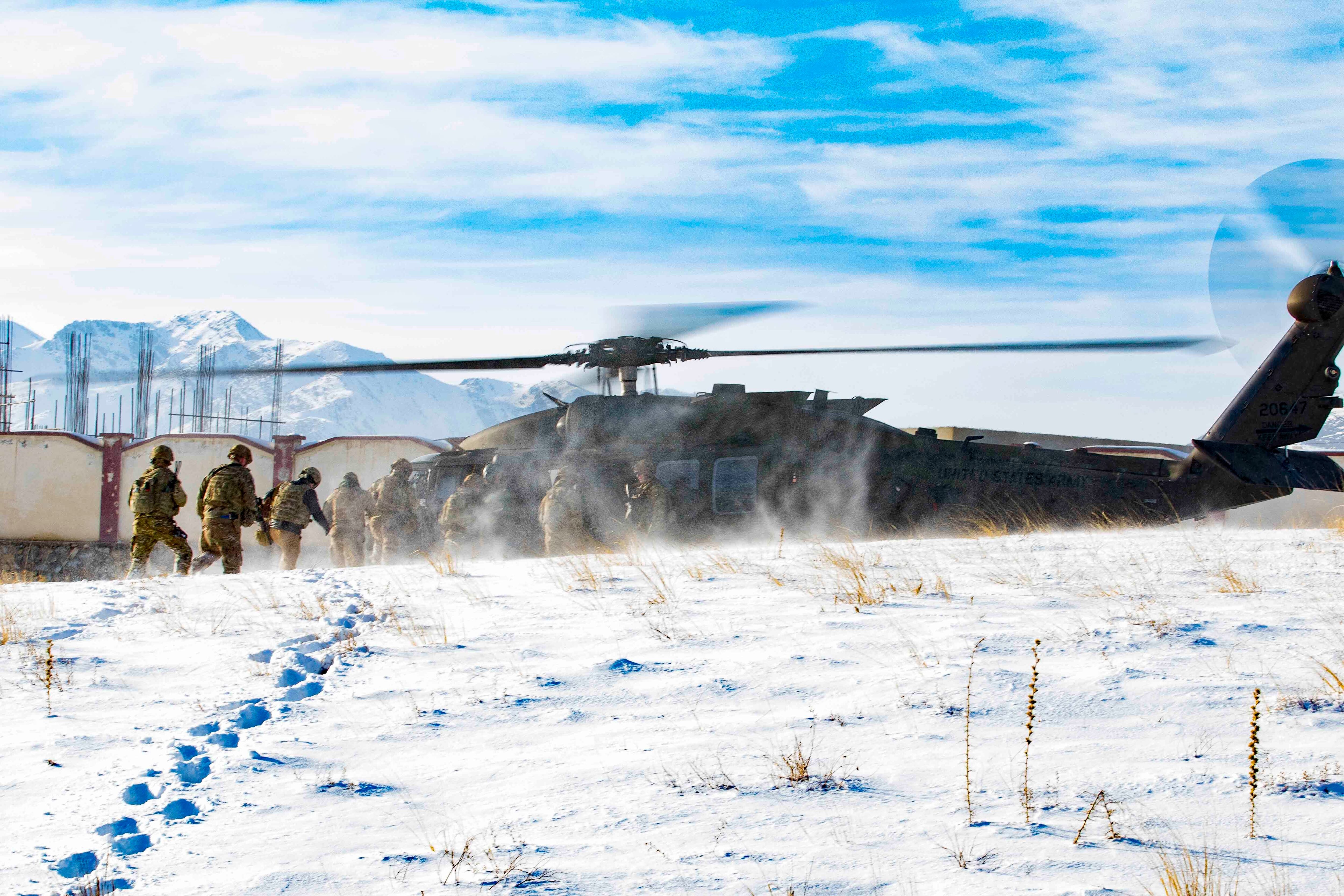 Afghan and U.S. soldiers prepare for extraction following a key leader engagement Jan. 16, 2020, in southeastern Afghanistan.