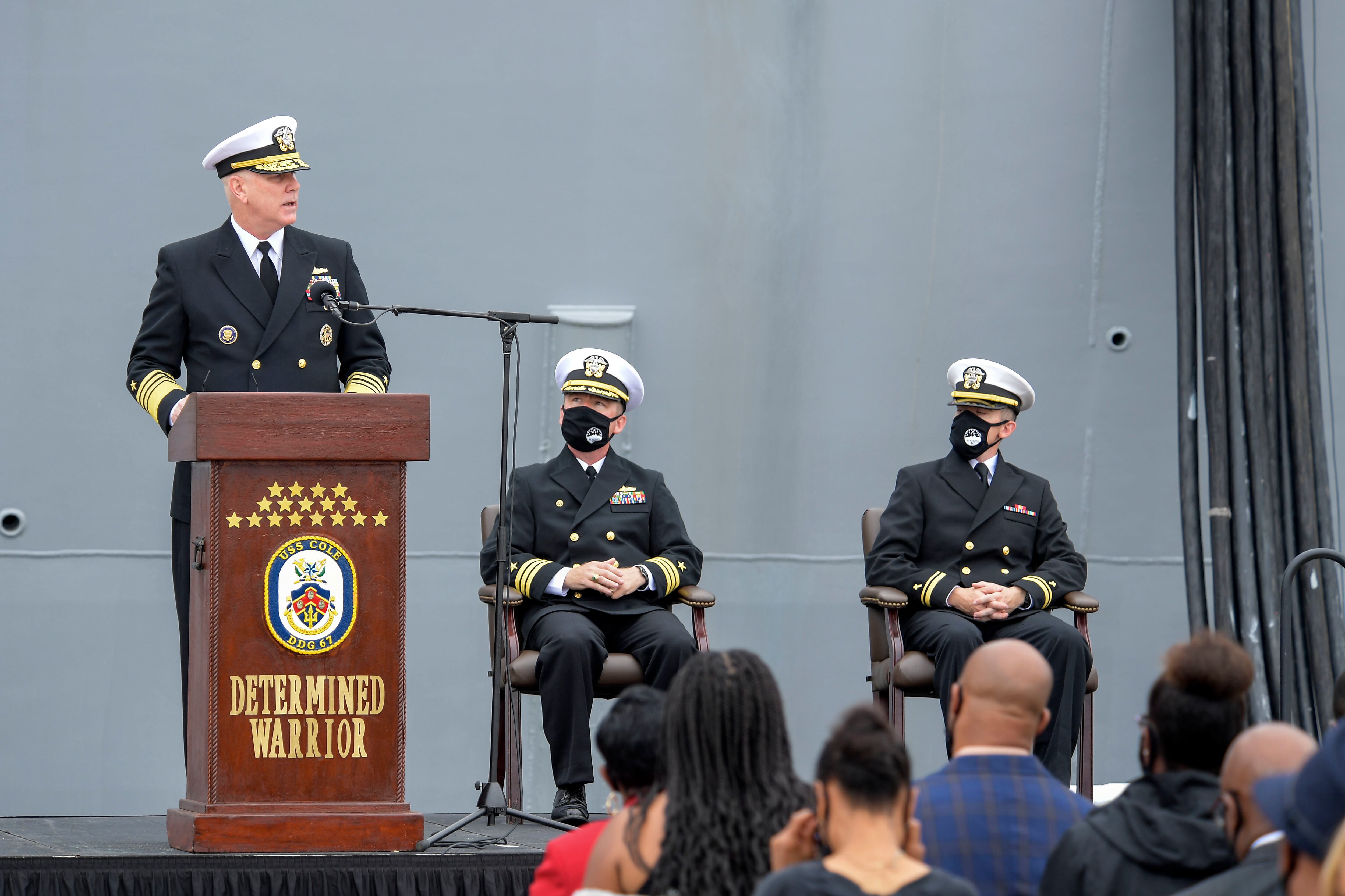 NORFOLK (Oct. 12, 2020) Adm. Christopher Grady, Commander, U.S. Fleet Forces Command, speaks at the Arleigh Burke-class guided missile destroyer USS Cole (DDG 67) 20th Anniversary memorial ceremony at Naval Station Norfolk. USS Cole was attacked by terrorists at 11:18 a.m. on Oct. 12, 2000, while moored for refueling in the Port of Aden, Yemen. The explosive bomb created a 40-by-60-foot hole on the port side of the ship, and the Cole's Sailors fought fires and flooding for the following 96 hours to keep the ship afloat. Commemoration events on the 20th anniversary of the attack remember and honor the 17 Sailors who were killed, the 37 who were injured and the Gold Star families. (U.S. Navy photo by Mass Communication Specialist 2nd Class Darien G. Kenney)