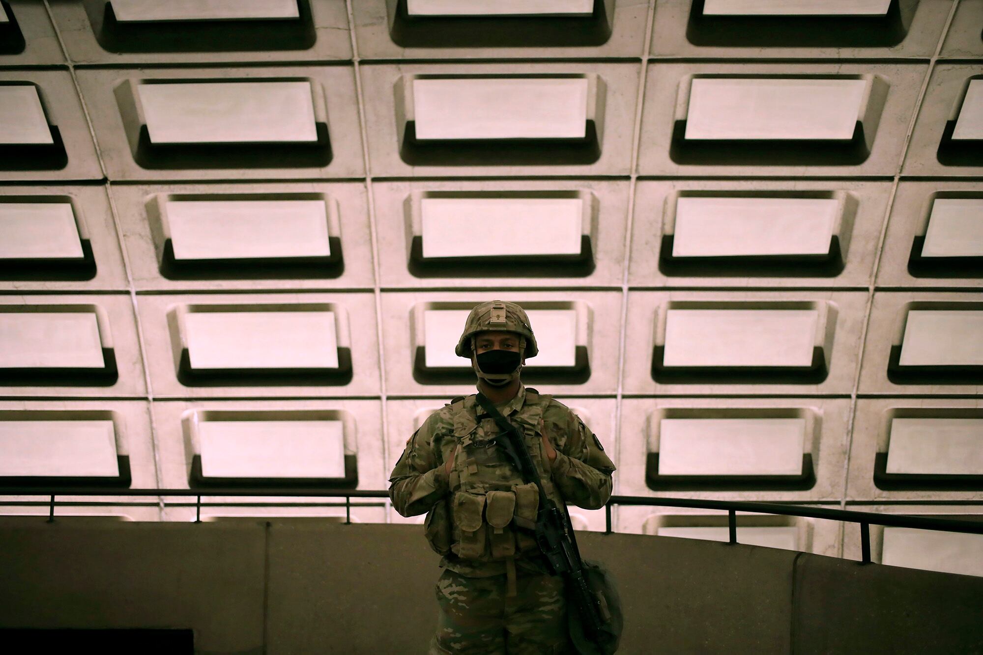 Soldiers from the North Carolina Army National Guard patrol the Rosslyn Metro station on the morning of the inauguration on Jan. 20, 2021, in Arlington, Va.