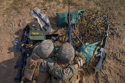 Marines fire an M240B machine gun during a team defense range as part of MEFEX 21.1 at Fort Drum, N.Y., Nov. 6, 2020.