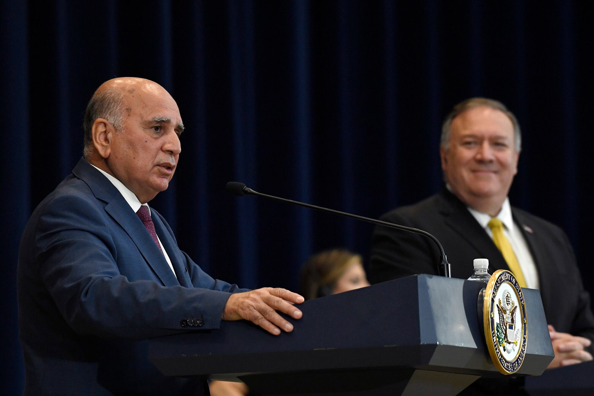 Iraqi Foreign Minister Fuad Hussein, left, speaks at the State Department in Washington, Wednesday, Aug. 19, 2020, during a news conference with Secretary of State Mike Pompeo, right.