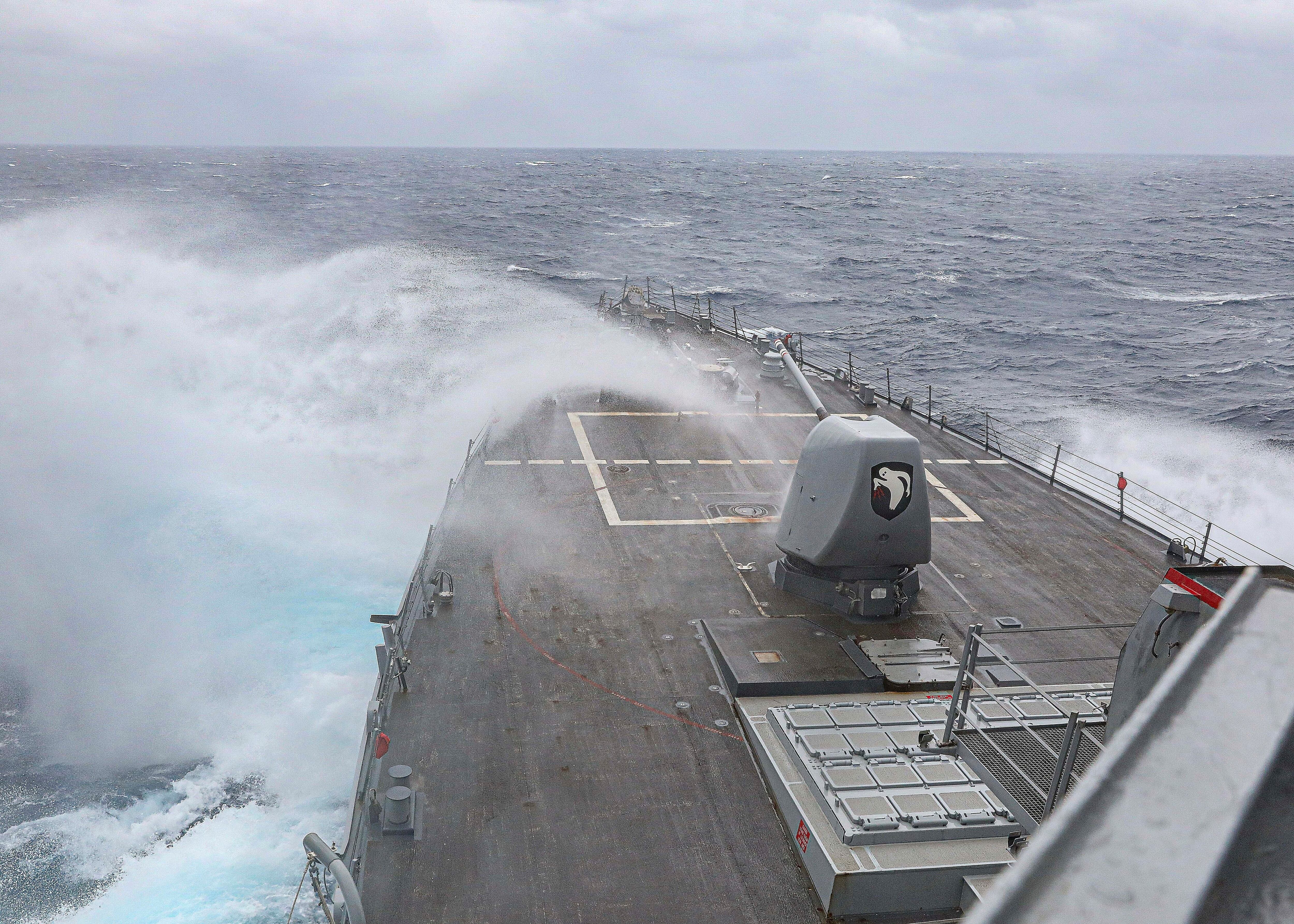 In this photo provided by the U.S. Navy, the Arleigh Burke-class guided-missile destroyer USS Milius steams in the Philippine Sea, on March 13, 2023.