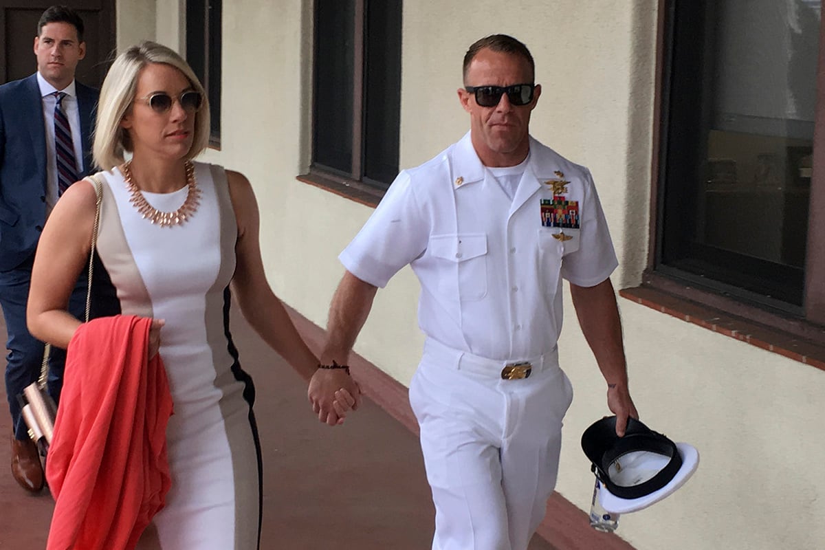 Navy Special Operations Chief Edward Gallagher, right, walks with his wife, Andrea Gallagher as they arrive to military court on Naval Base San Diego