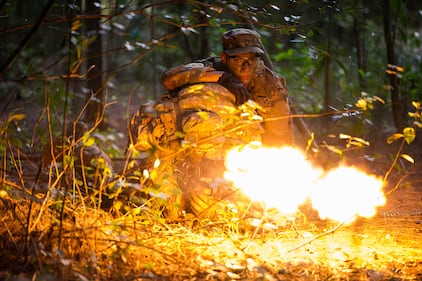 Staff Sgts. Jose Obregon and Joseph Pace, Ranger Assessment Course students, fire on opposing forces during a simulated react to contact near Schofield Barracks, Oahu, Hawaii, May 23, 2019.