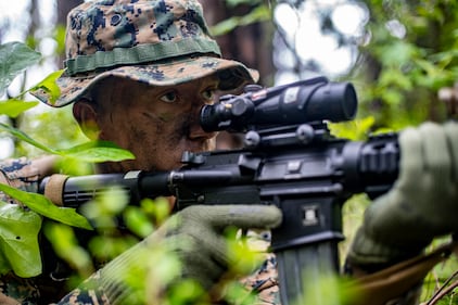 Cpl. Geoffrey Daily, a field radio operator with Special Purpose Marine Air-Ground Task Force - Southern Command, provides security during a field exercise at Camp Lejeune, N.C.