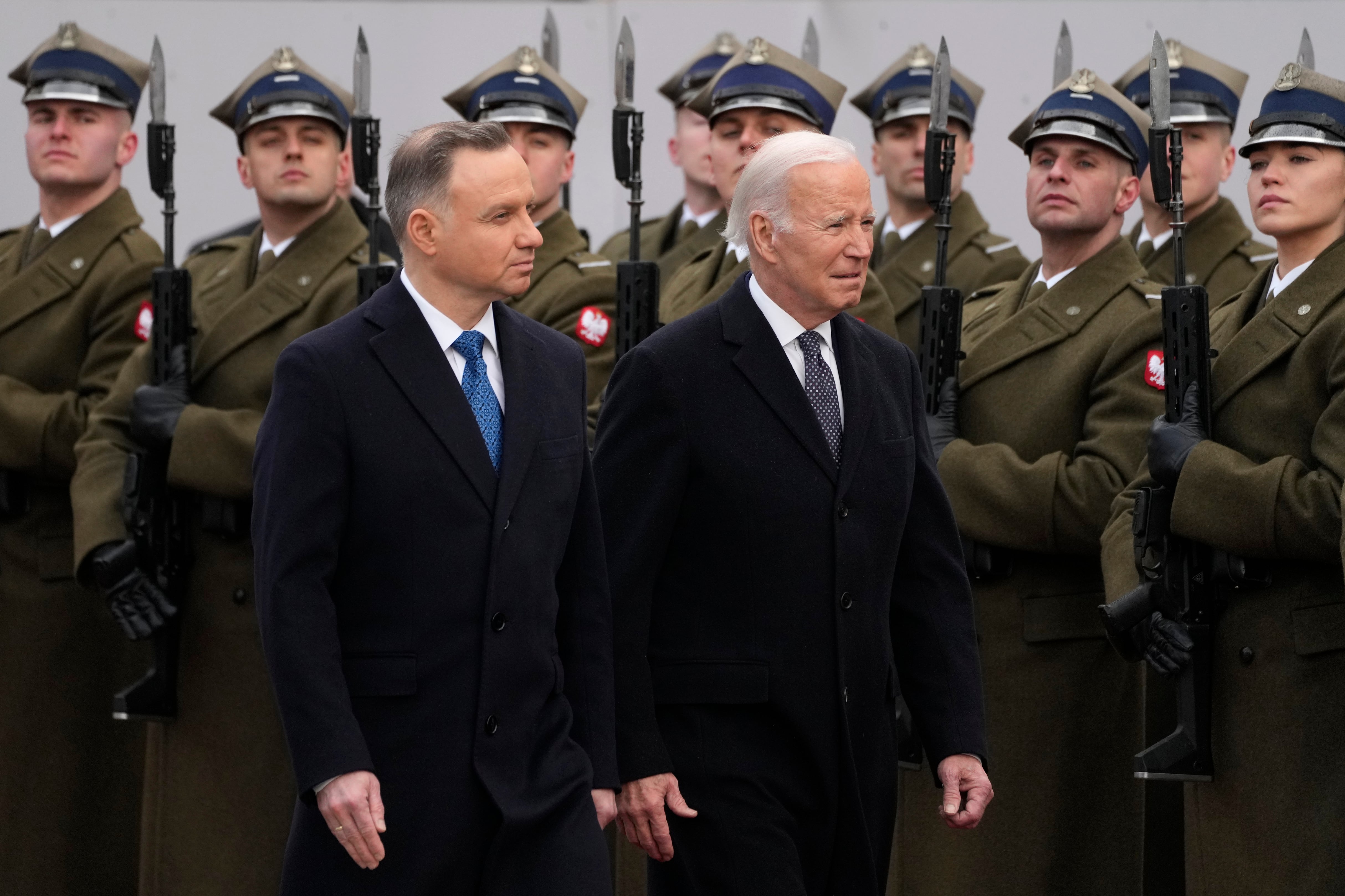 Polish President Andrzej Duda, left, welcomes President Joe Biden at the Presidential Palace in Warsaw, Ukraine, Tuesday, Feb. 21, 2023.