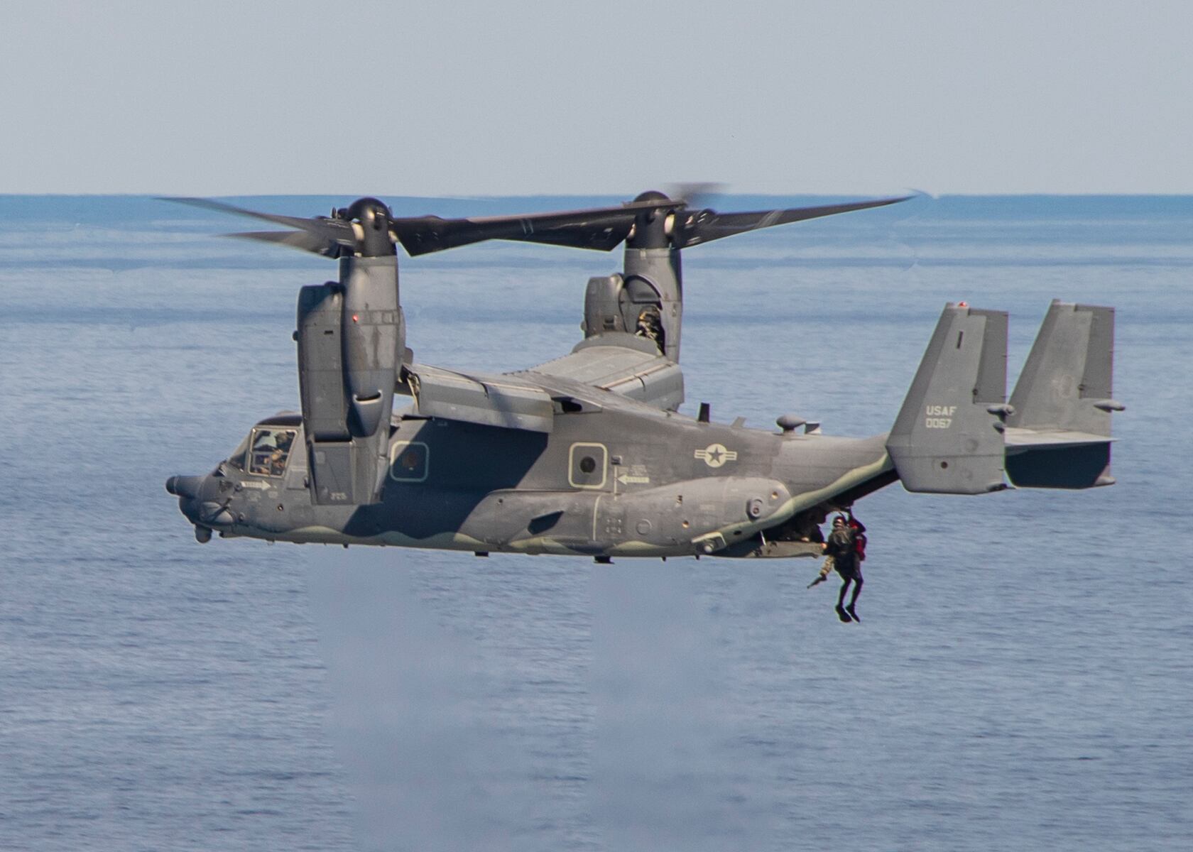 A U.S. Air Force CV-22 Osprey, attached to the 21st Special Operations Squadron operating out of Yokota Air Base, Japan, conducts a search-and-rescue exercise in conjunction with the aircraft carrier USS Ronald Reagan (CVN 76) during Keen Sword 21 on Oct. 28, 2020, in the Philippine Sea.