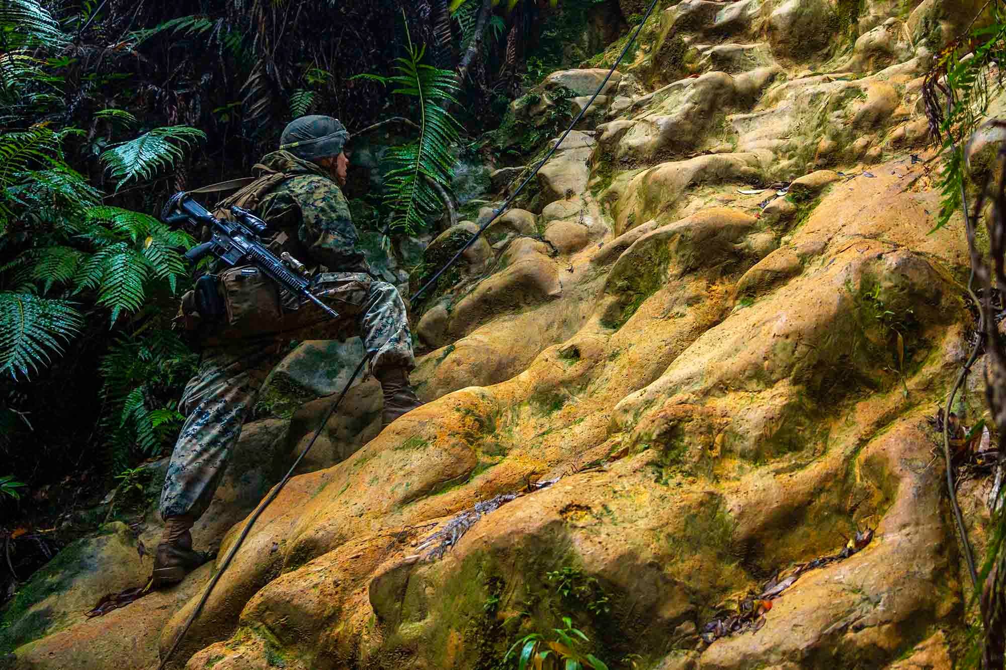 U.S. Marine Corps Lance Cpl. Ethan Sawyer conducts route reconnaissance during the 3d Marine Division Rifle Squad Competition at Camp Gonsalves, Okinawa, Japan, Jan. 11, 2021.