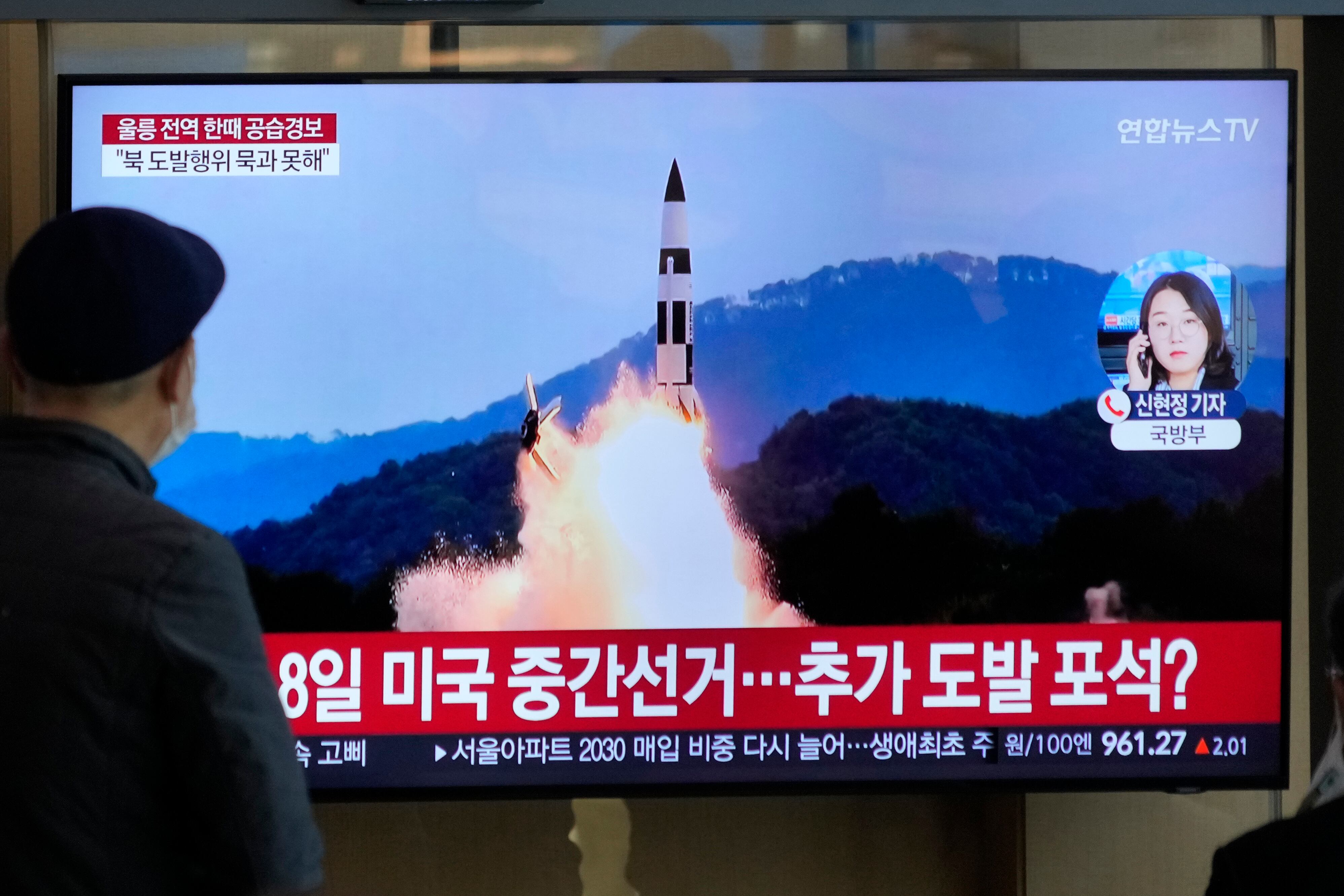 A TV screen shows a file image of North Korea's missile launch during a news program at the Seoul Railway Station in Seoul, South Korea, Wednesday, Nov. 2, 2022.