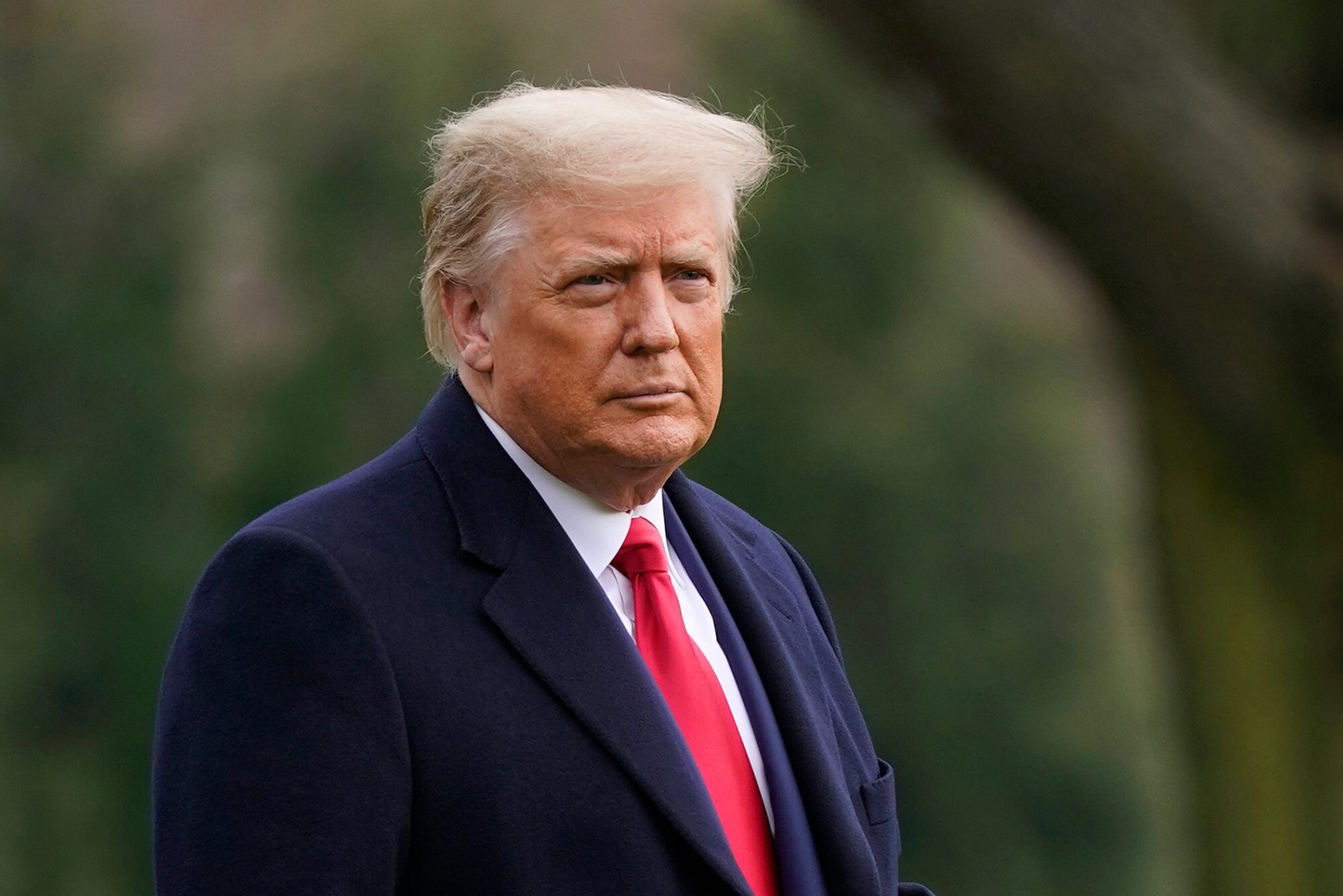 In this Dec. 12, 2020, file photo, President Donald Trump walks on the South Lawn of the White House in Washington before boarding Marine One.