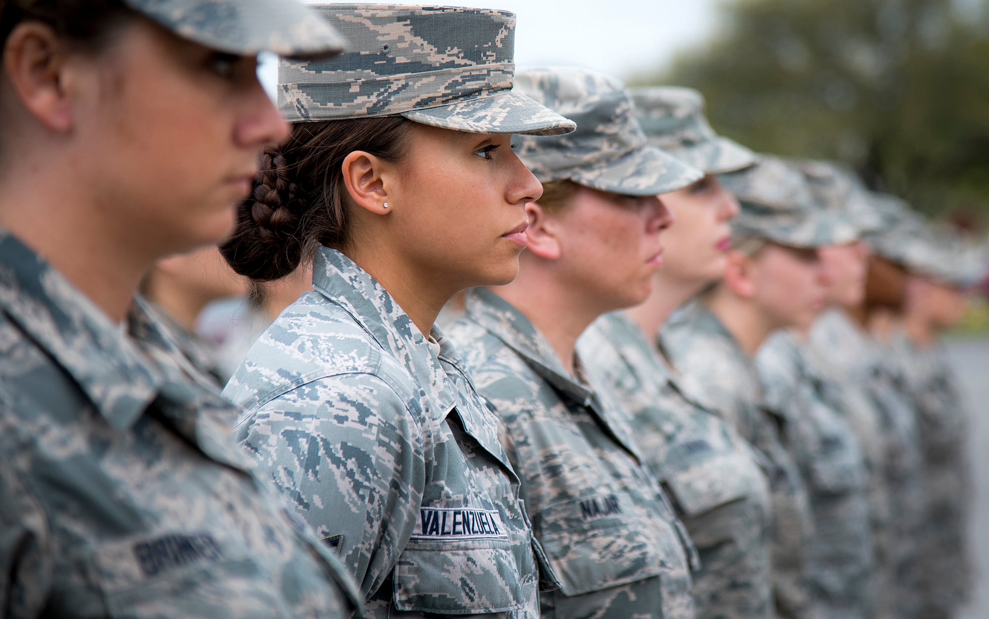 Senior Airman Heather Valenzuela, 96th Medical Group, stands at parade rest as part of an all-female formation prior to the base retreat ceremony March 30, 2017, at Eglin Air Force Base, Fla.