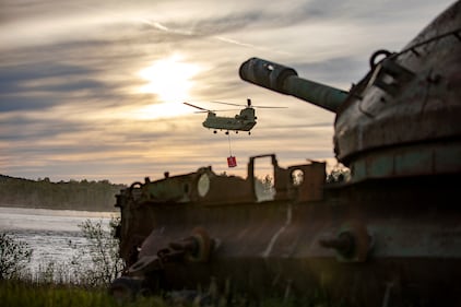 U.S. Soldiers practice fire suppression training using a Bambi water bucket in a CH-47 Chinook helicopter on Grafenwoehr Training Area, Germany, May 12, 2020.