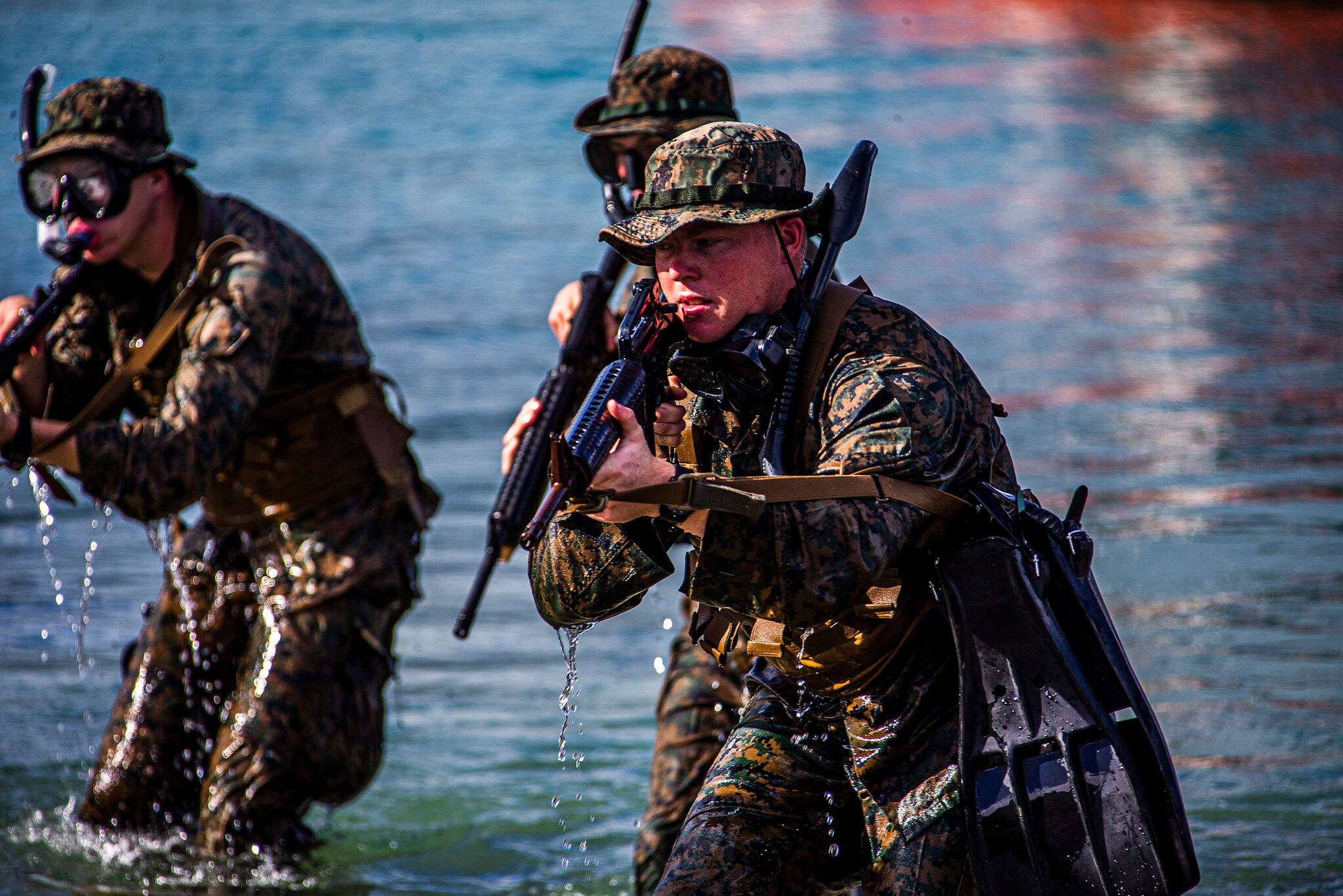 Marines hit the shore during an amphibious assault exercise on Marine Corps Base Hawaii, April 28, 2020.