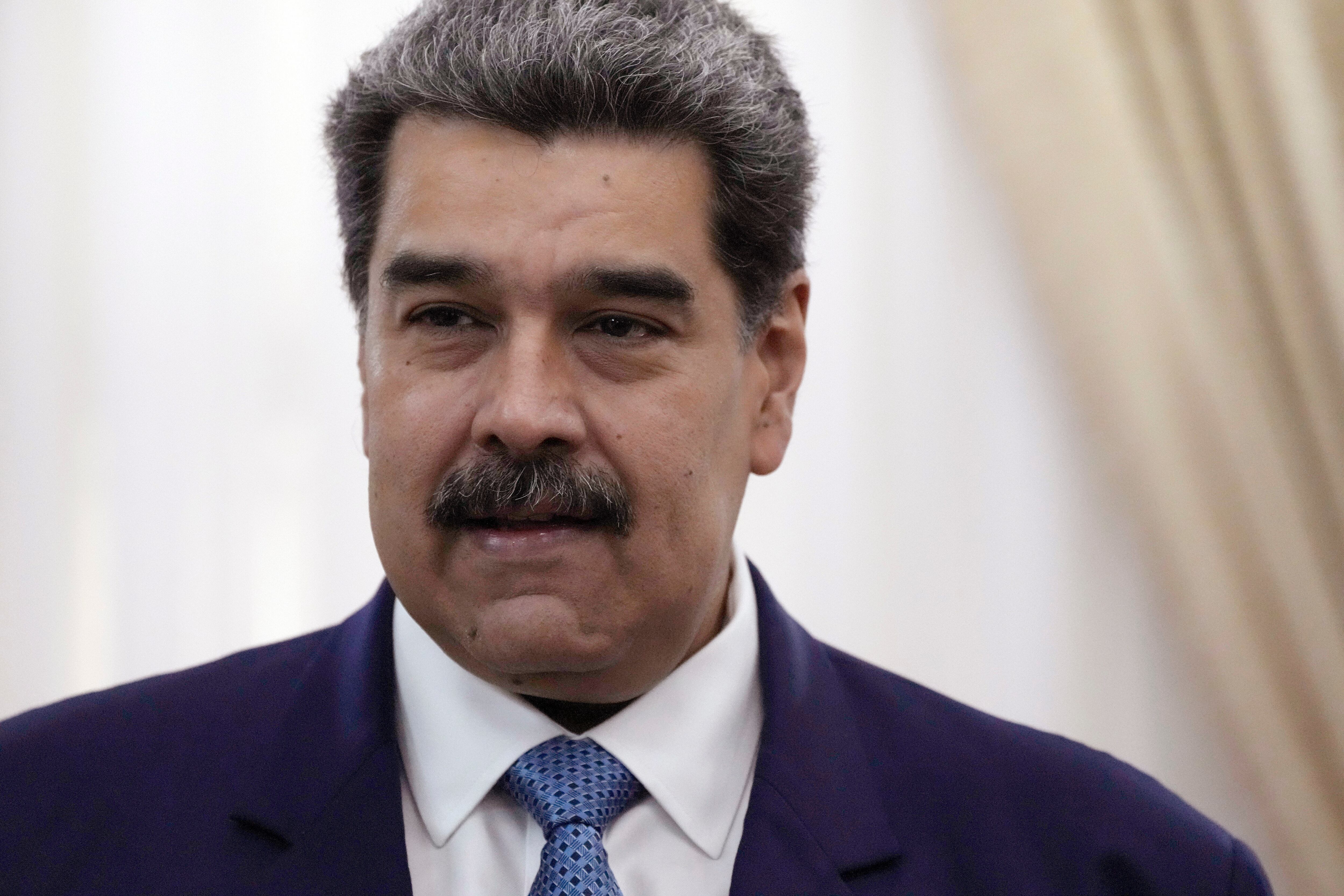 Venezuelan President Nicolas Maduro stands before a meeting at the presidential palace in Caracas, Venezuela, on July 11, 2022.