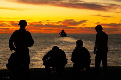 Sailors and Marines aboard the Wasp-class amphibious assault ship USS Essex (LHD-2) post security from the flight deck during exercise Steel Knight/Dawn Blitz (SK/DB) 21 off the coast of Southern California, Dec. 4, 2020.