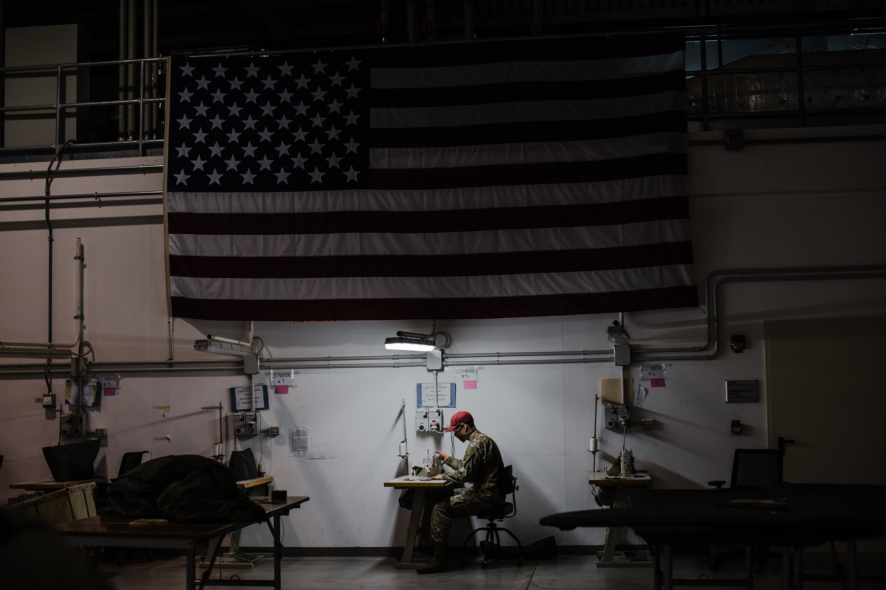 U.S. Army parachute riggers sew face mask prototypes at Aviano Air Base, Italy.