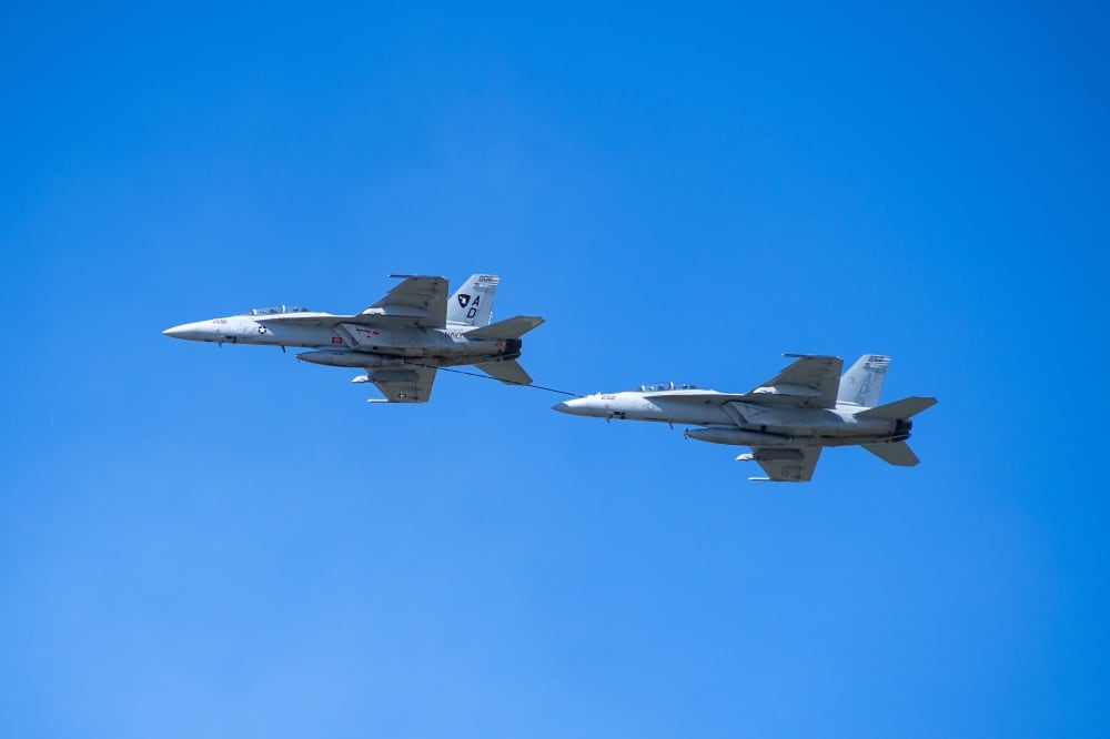 A Navy F/A-18 Super Hornet refuels one of its brethren earlier this year. (Navy)