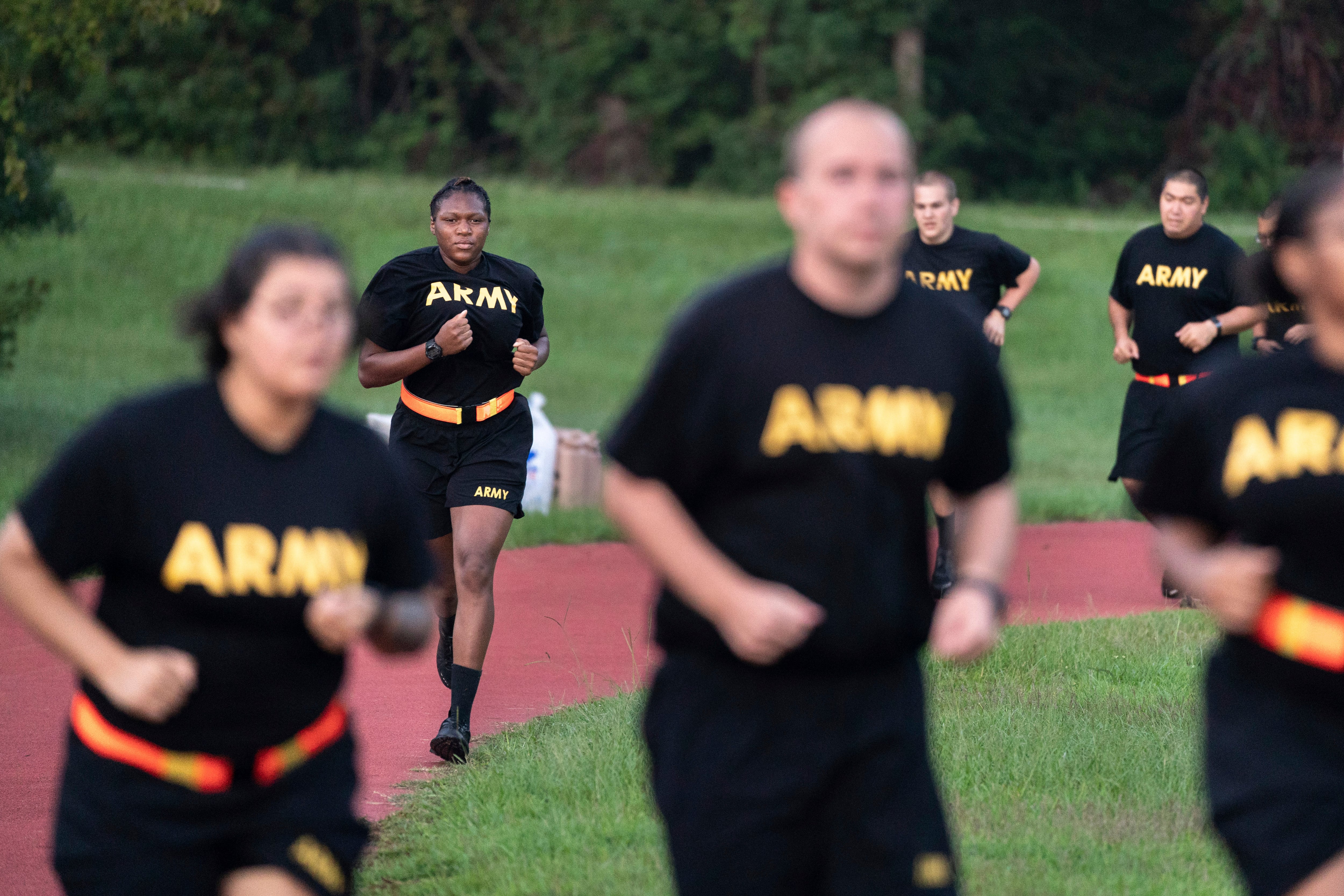 Students in the new Army prep course run around a track during physical training exercises at Fort Jackson, South Carolina, Aug. 27, 2022.