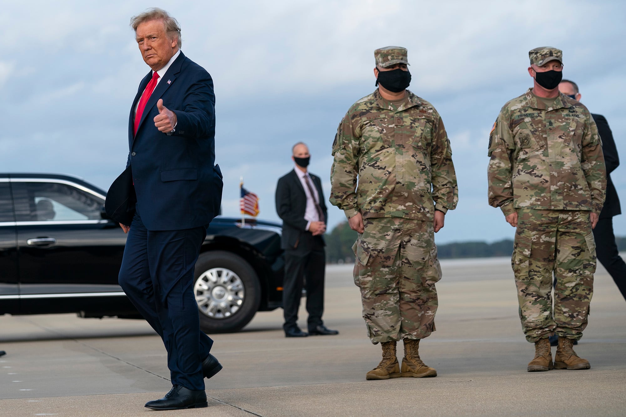 President Donald Trump gives a thumbs up after arriving at Pope Army Field for an event with troops at Fort Bragg, Thursday, Oct. 29, 2020, in Pope Field, N.C.