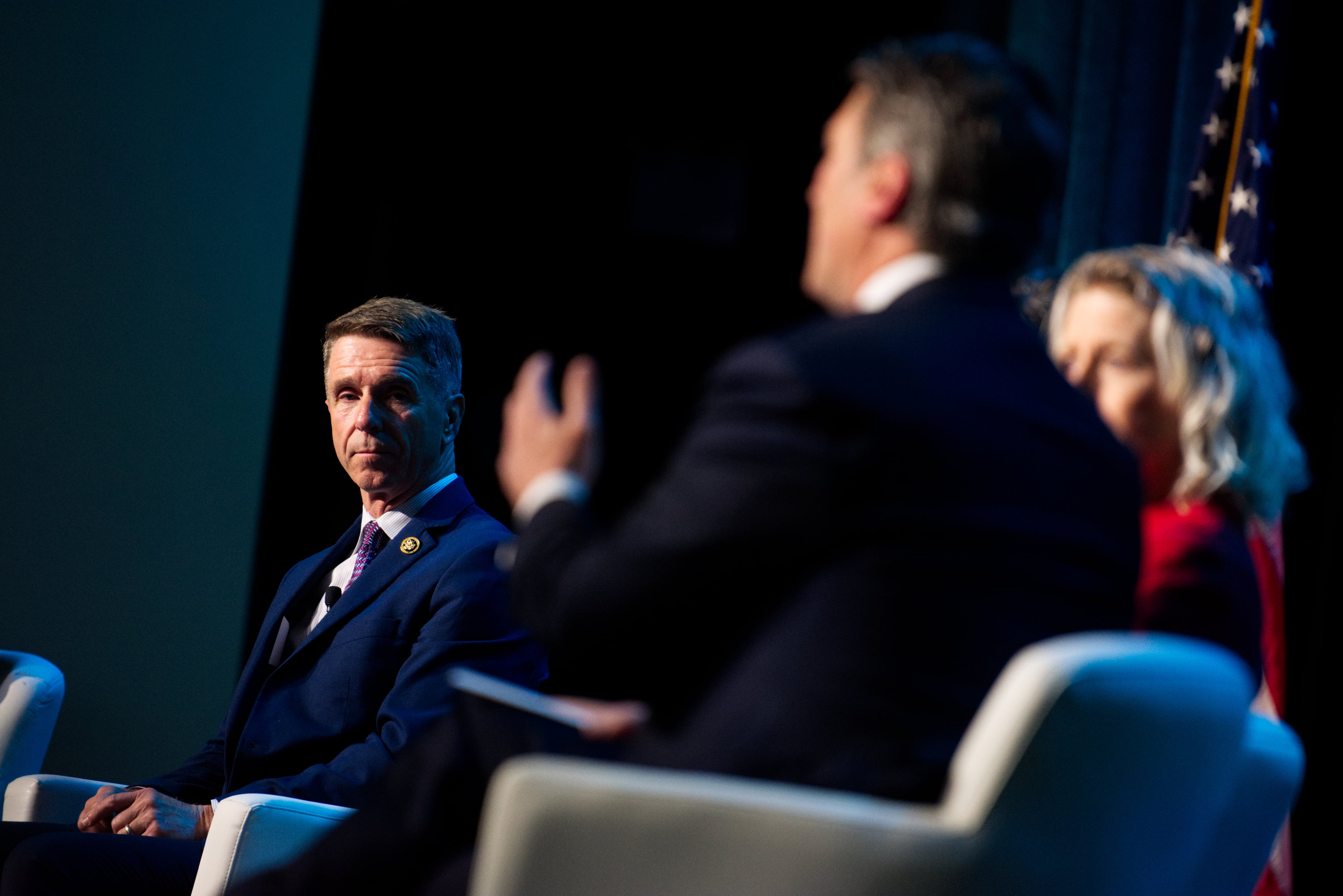 U.S. Rep. Rob Wittman, a Virginia Republican, listens to a fellow representative April 9, 2024, at the Sea-Air-Space naval conference.