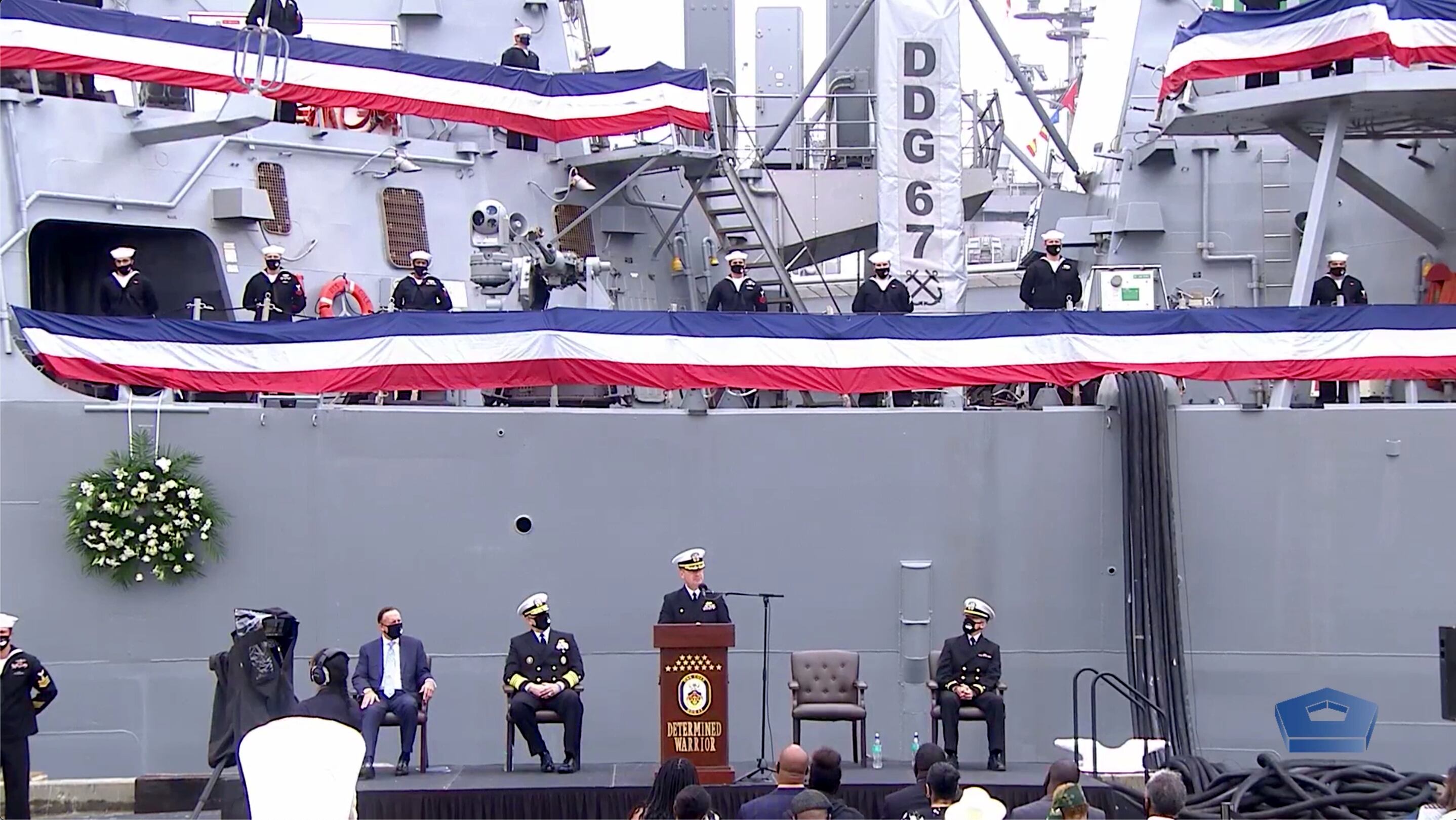 Cmdr. Edward Pledger, commanding officer of the destroyer Cole, delivers remarks during the 20th anniversary of the 2000 terrorist attack on the ship. (Photo: DOD video screen shot)